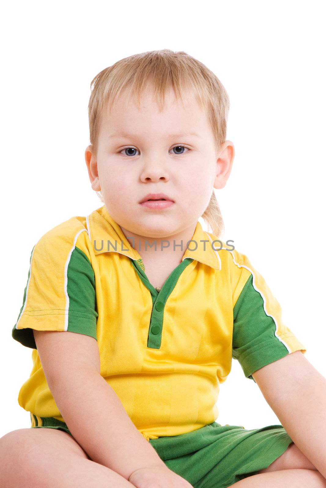 boy of three years old sits on the floor