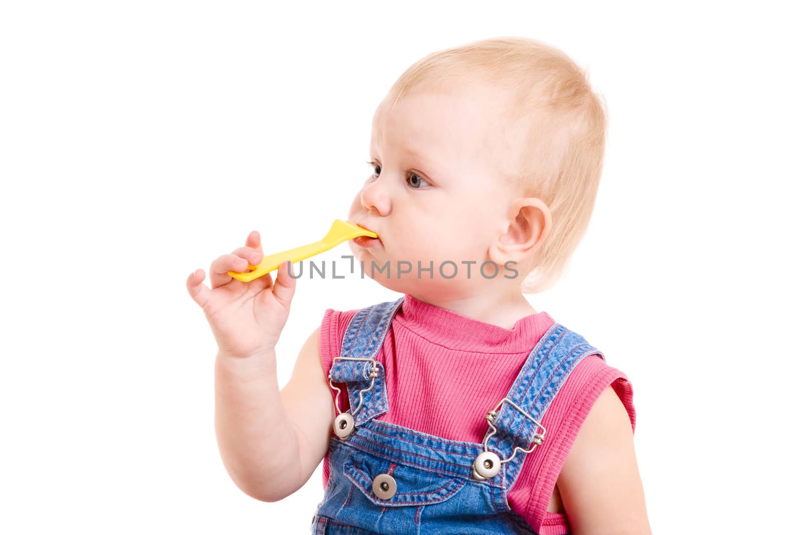 small girl eating with a toy fork