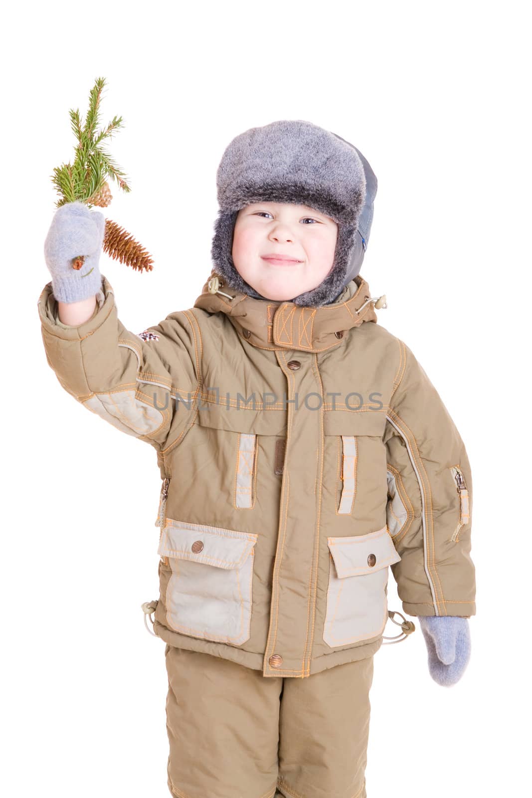 a boy in winter coat with a branch of fur tree by vsurkov