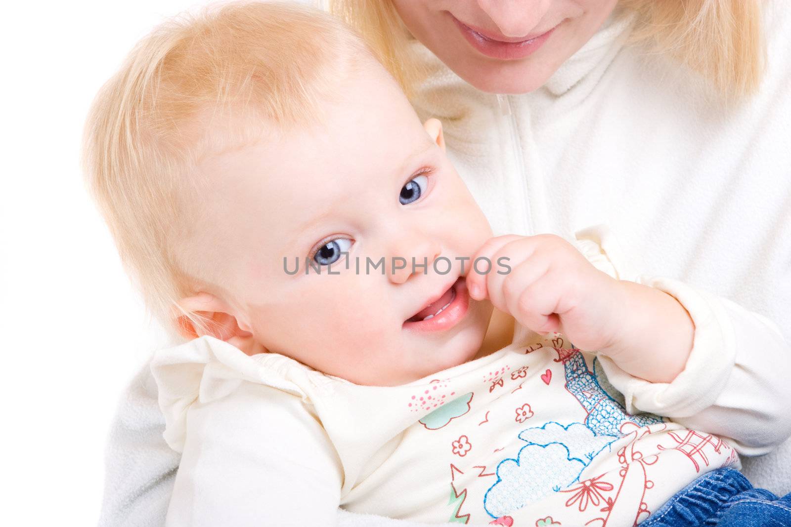 child on the hands of mom