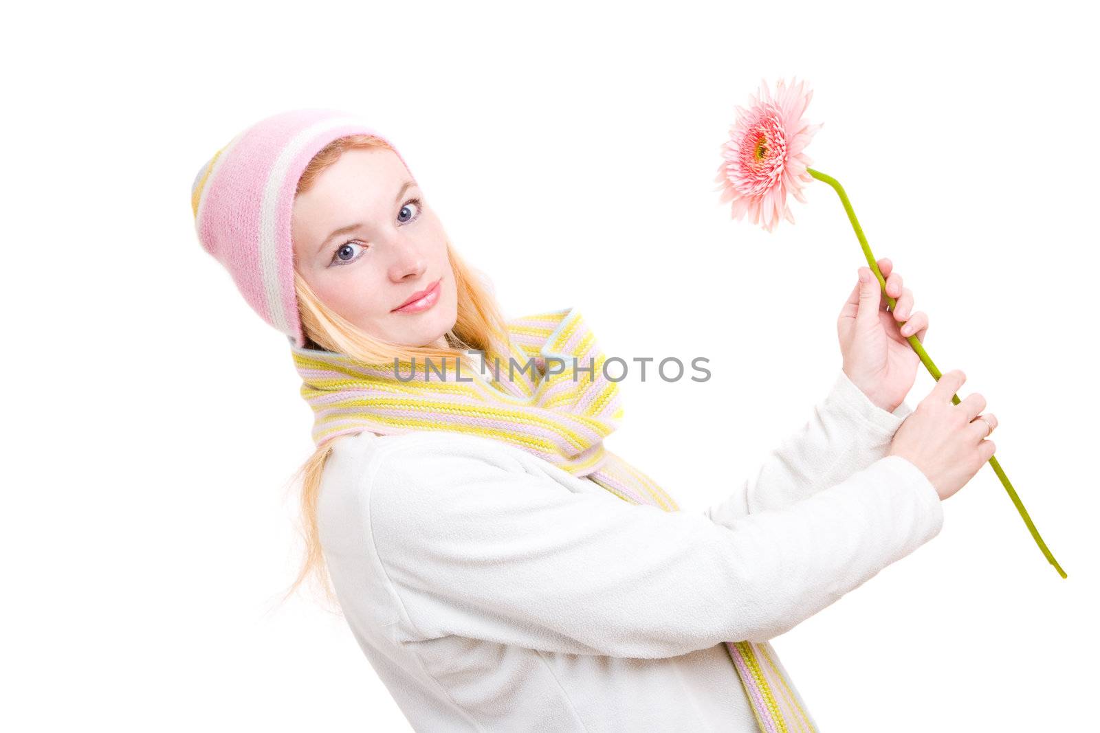 The pretty woman dance with a pink flower in hands