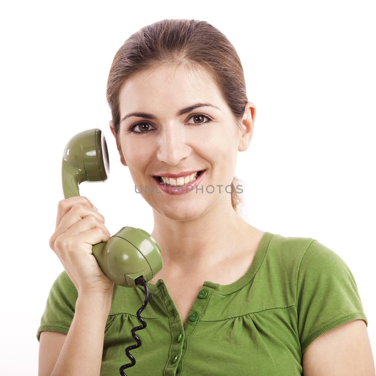Beautiful woman holding and talking with a vintage phone