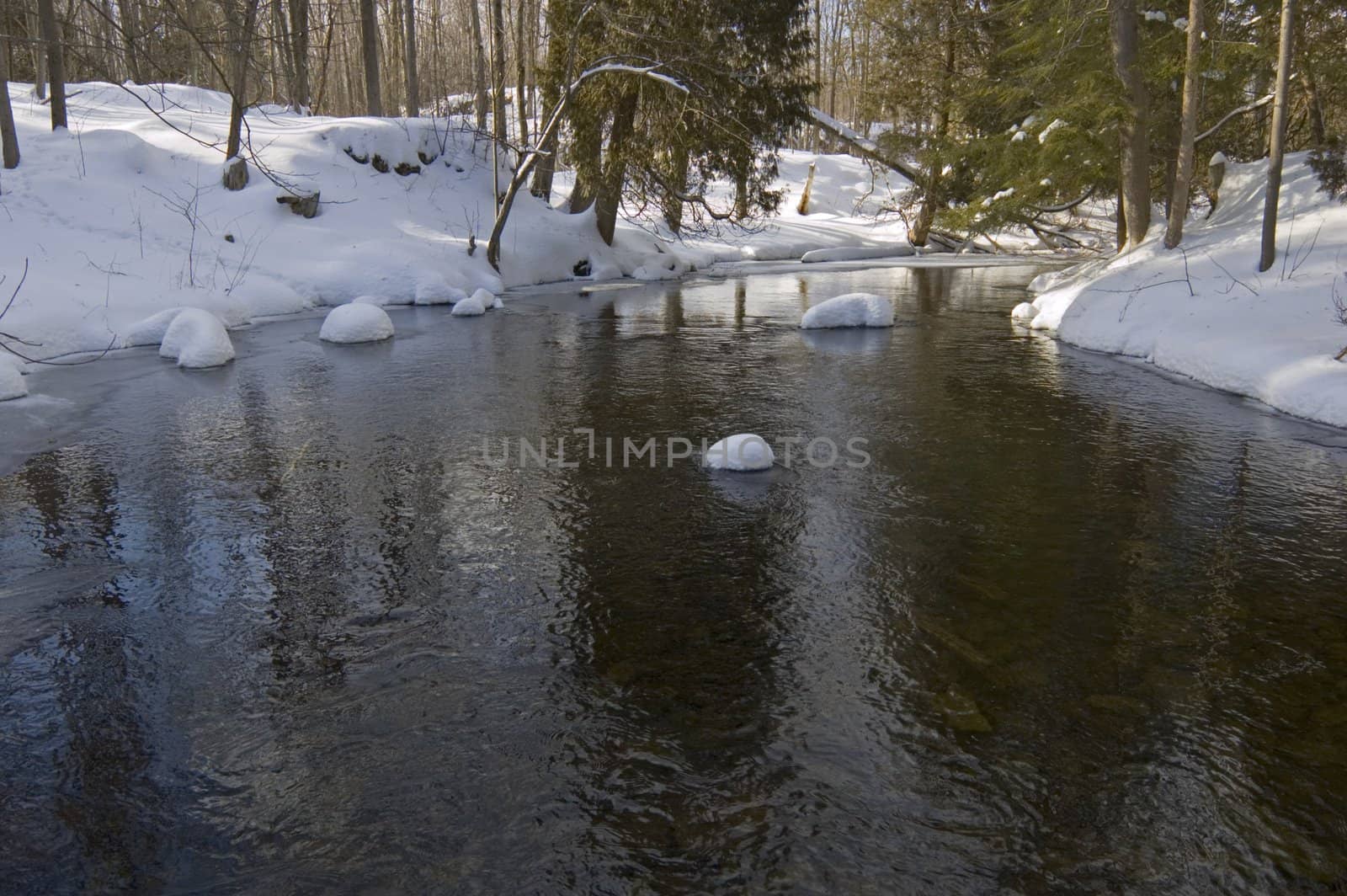 Snowy creek with snow bumps