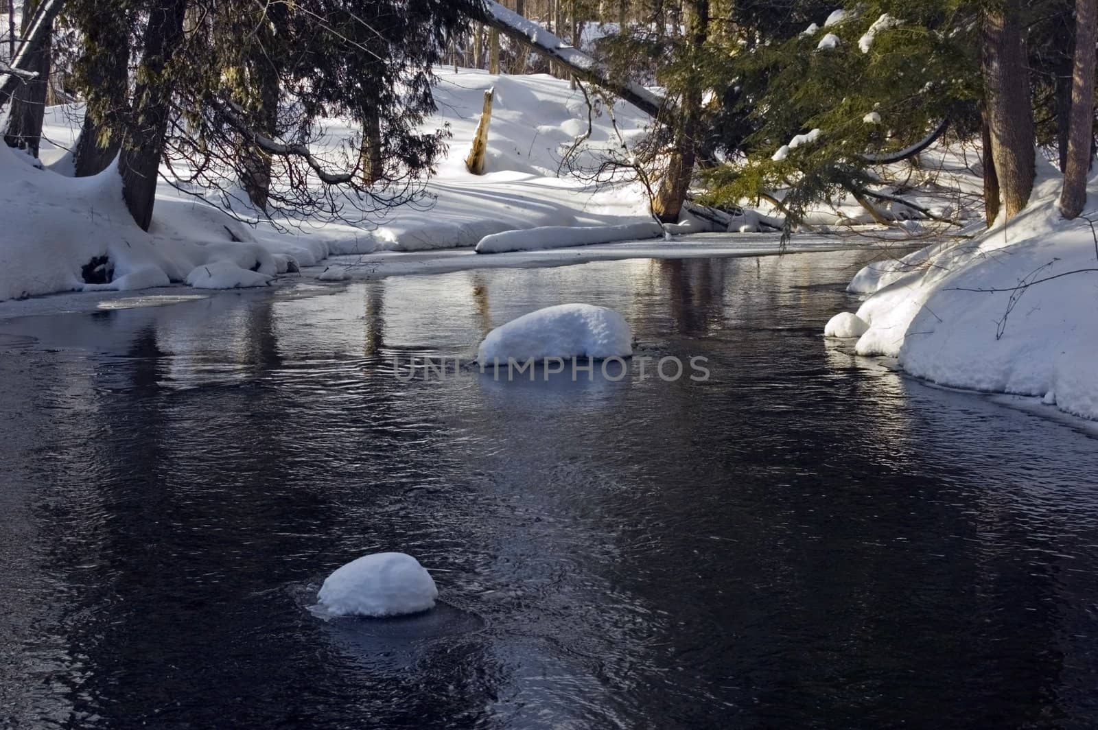 Snowy creek with snow bumps