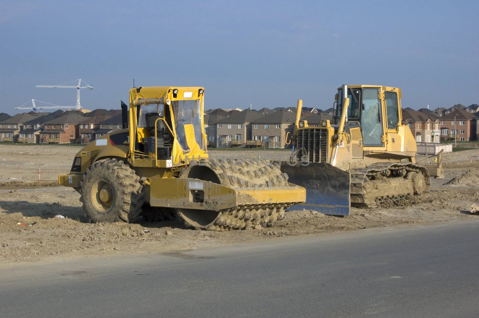Truck, new houses and house's construction sites