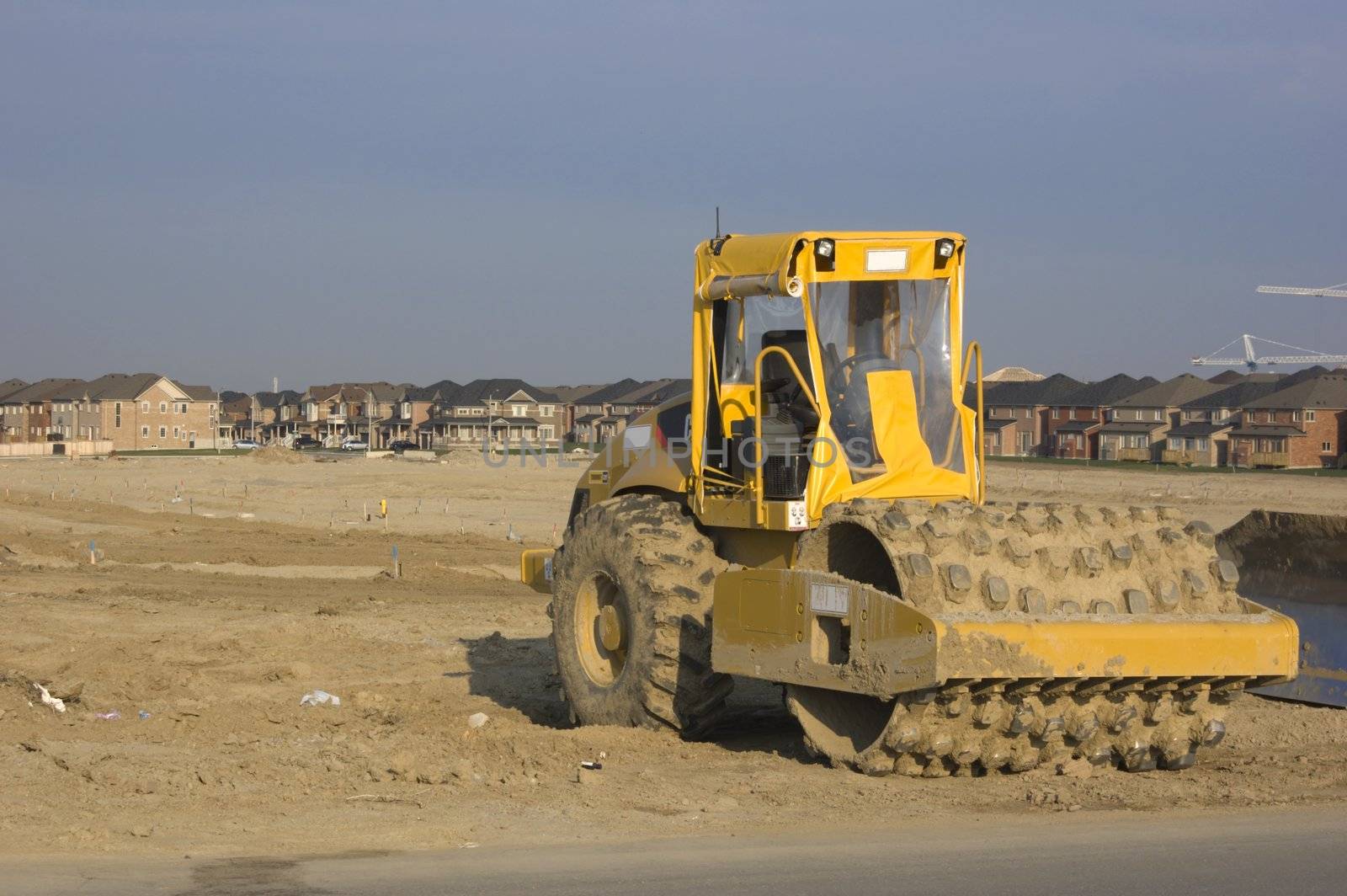 Truck, new houses and house's construction sites