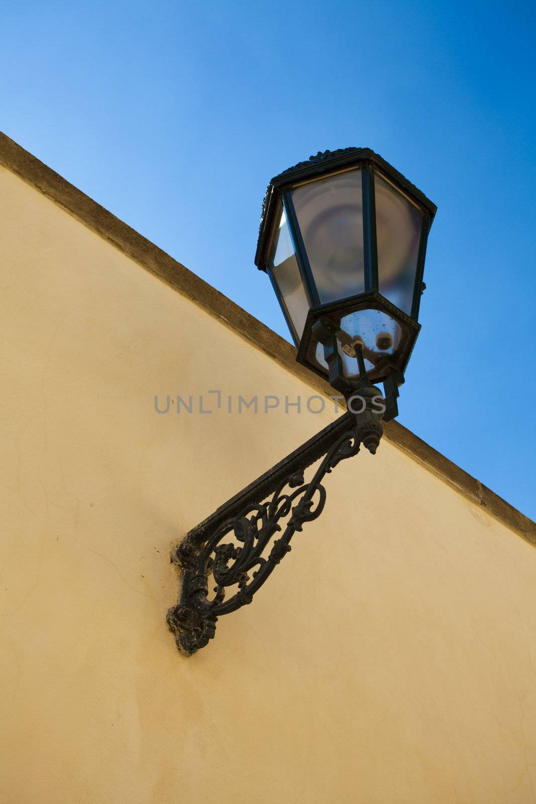 The lantern on the wall against the sky by jannyjus