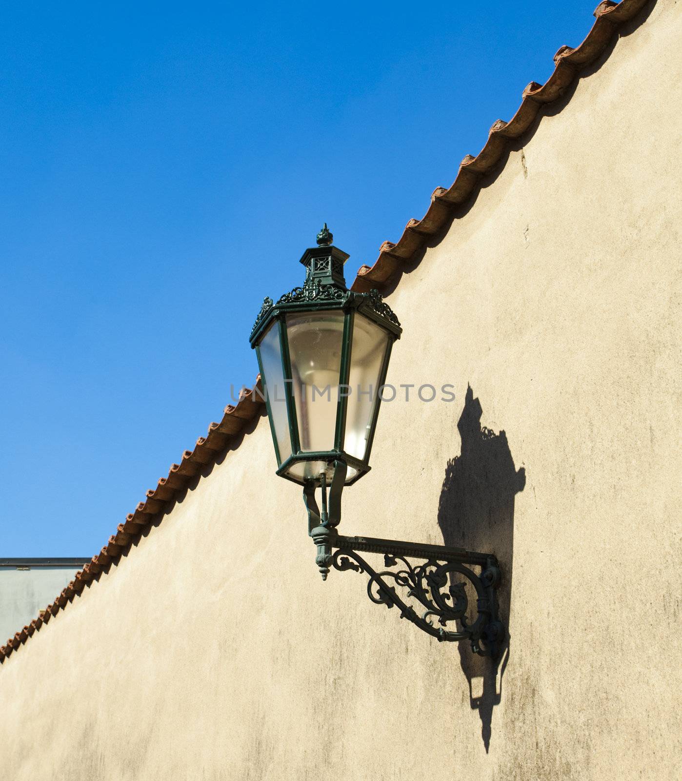 The lantern on the wall against the sky by jannyjus