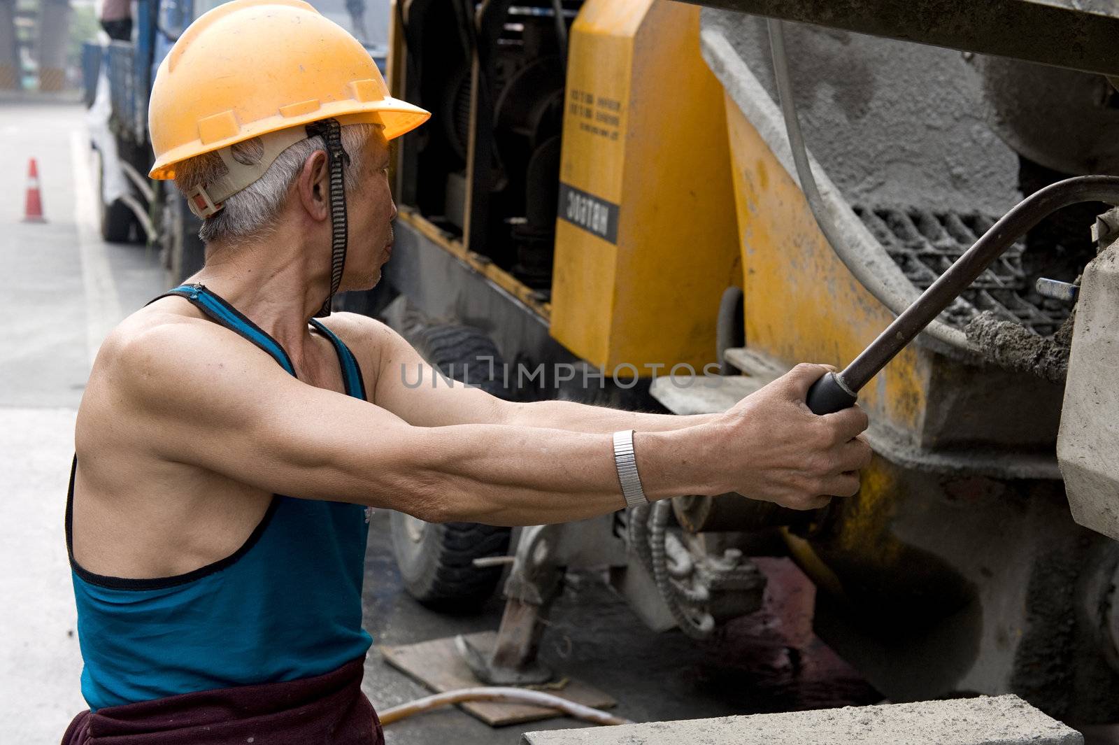 hardworking laborer on construction site by jackq