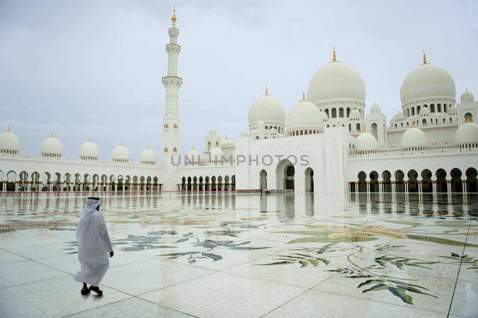 arab man walking in a Grand Mosque