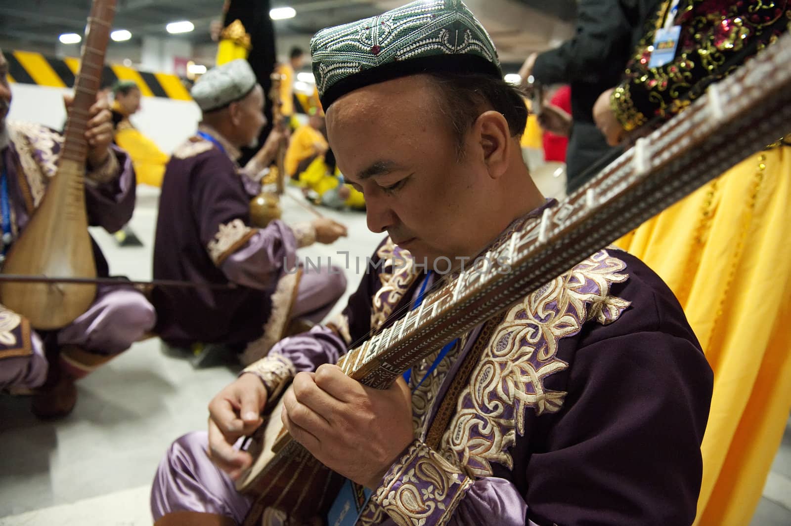 CHENGDU - MAY 29: Uighur Maixirefu folk musician performs in the 3rd International Festival of the Intangible Cultural Heritage.May 29, 20011 in Chengdu, China.