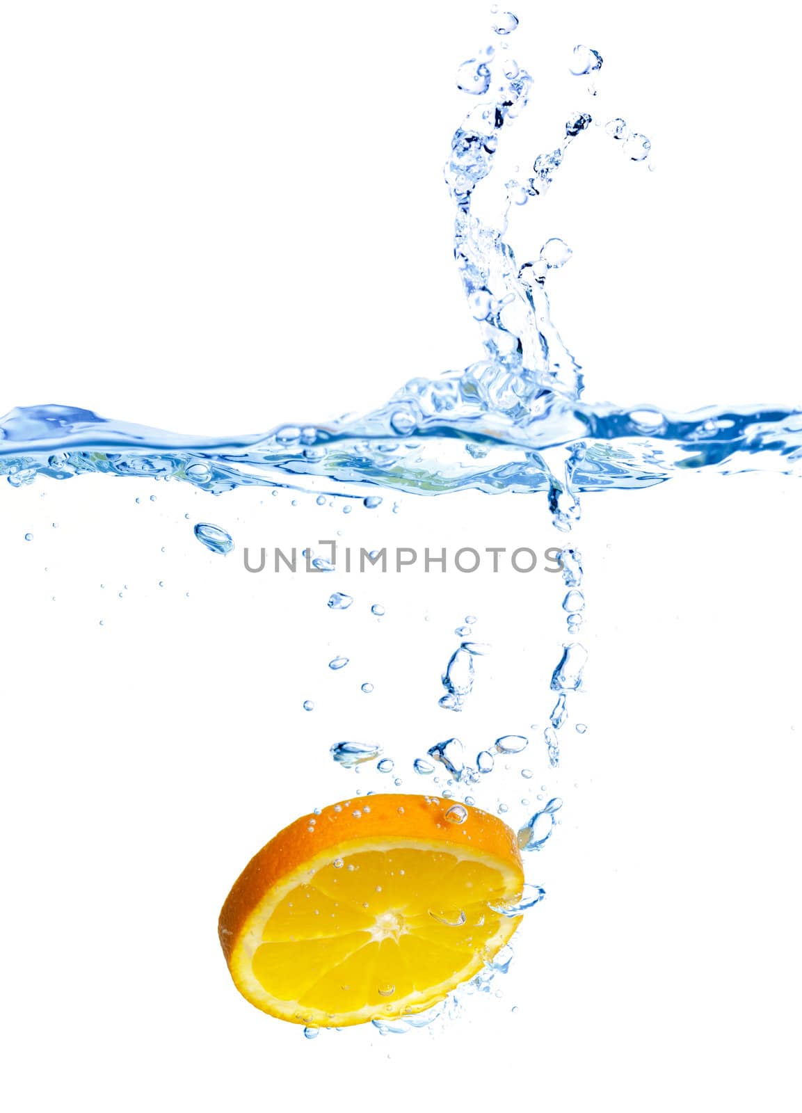 Fresh orange dropped into water with splash  by Discovod