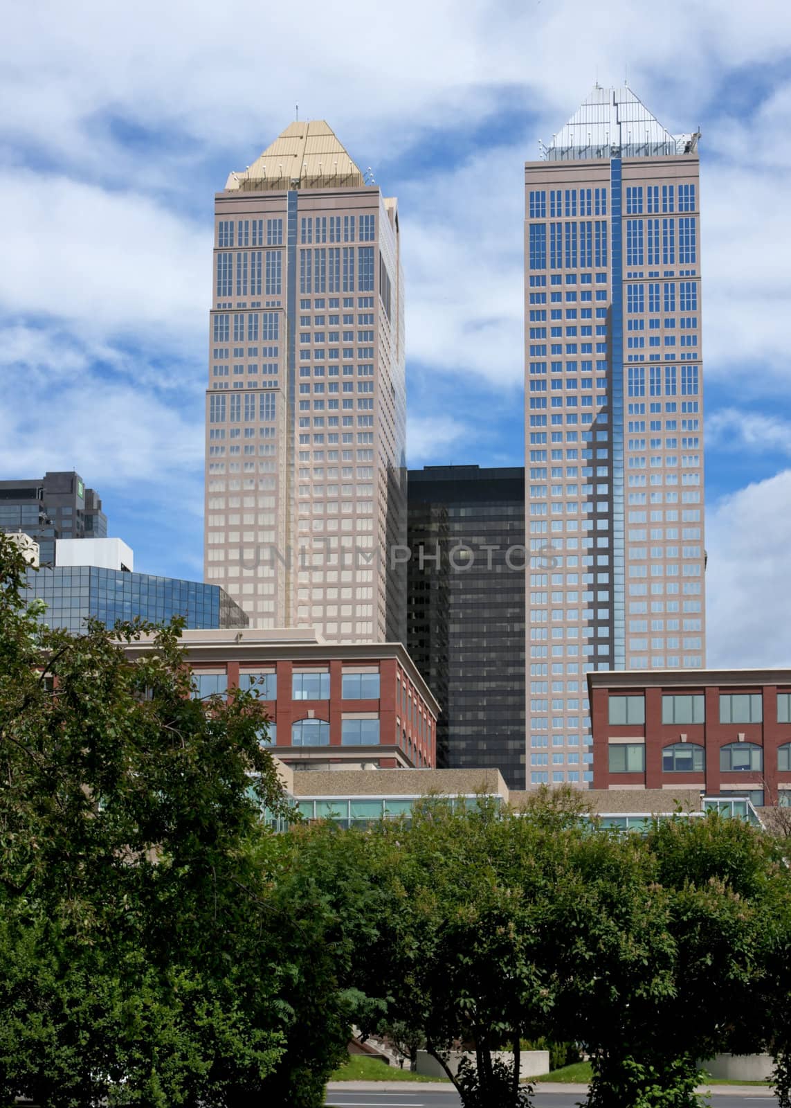 Two towers of 'Bankers Hall' rise in the sky.