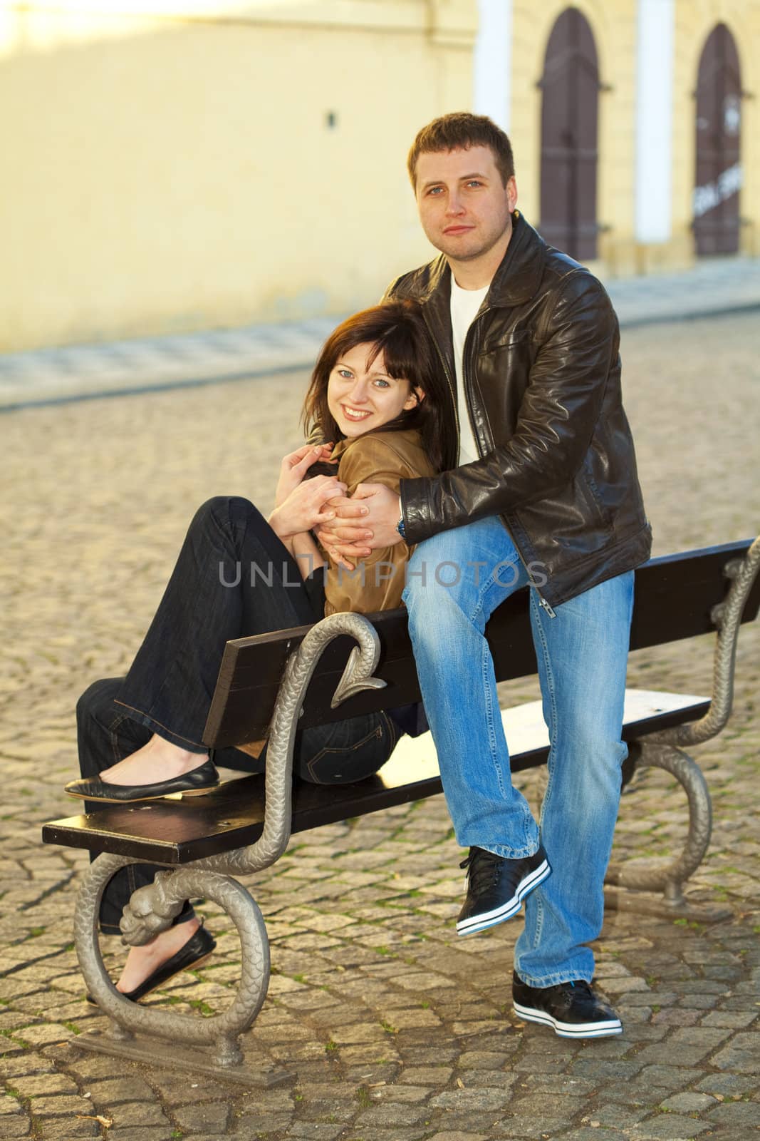 love couple sitting on a bench by jannyjus