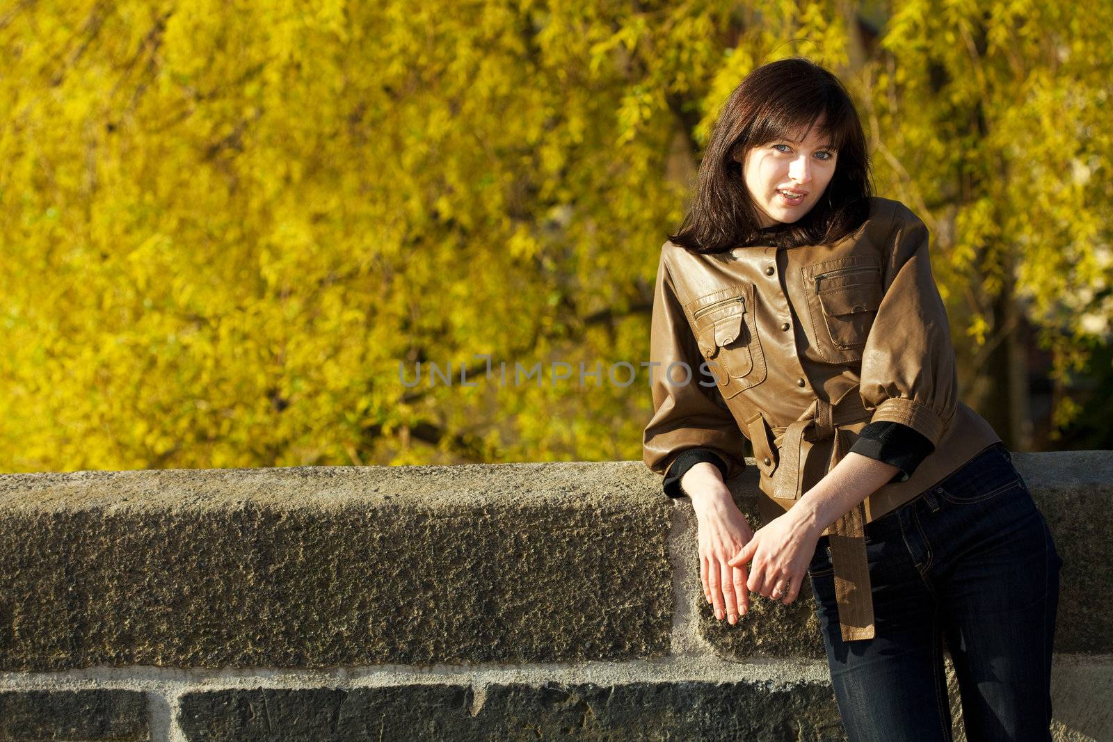 beautiful young woman standing on the bridge