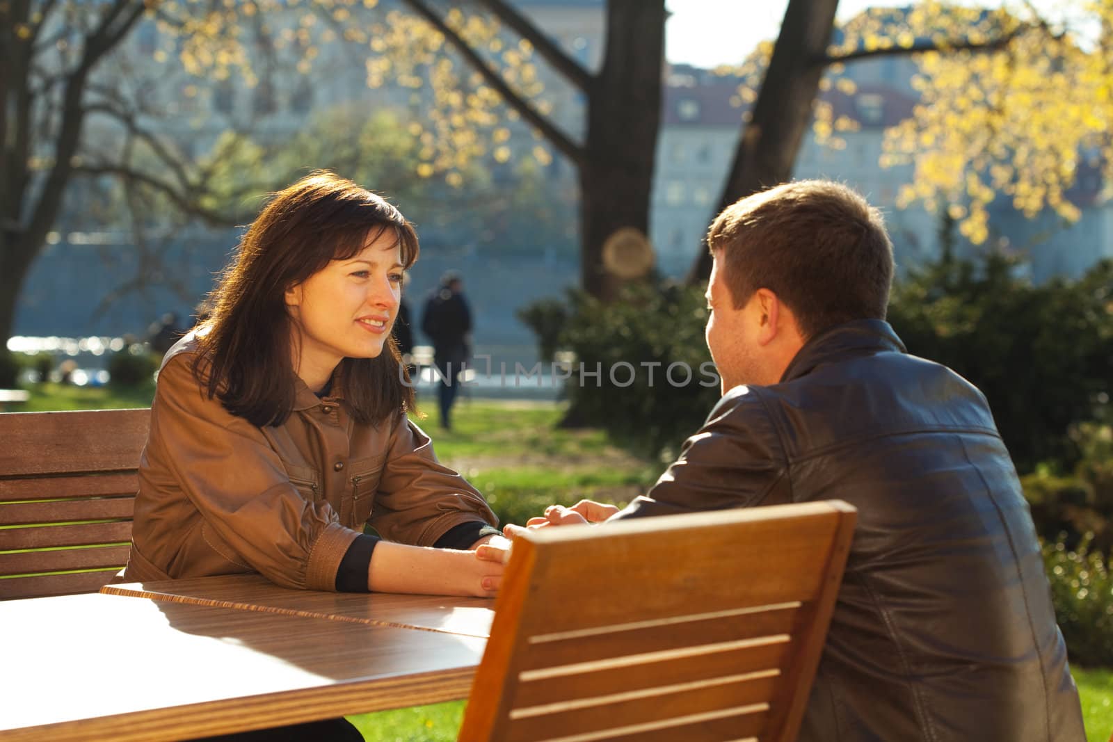 love couple sitting at a table in a cafe