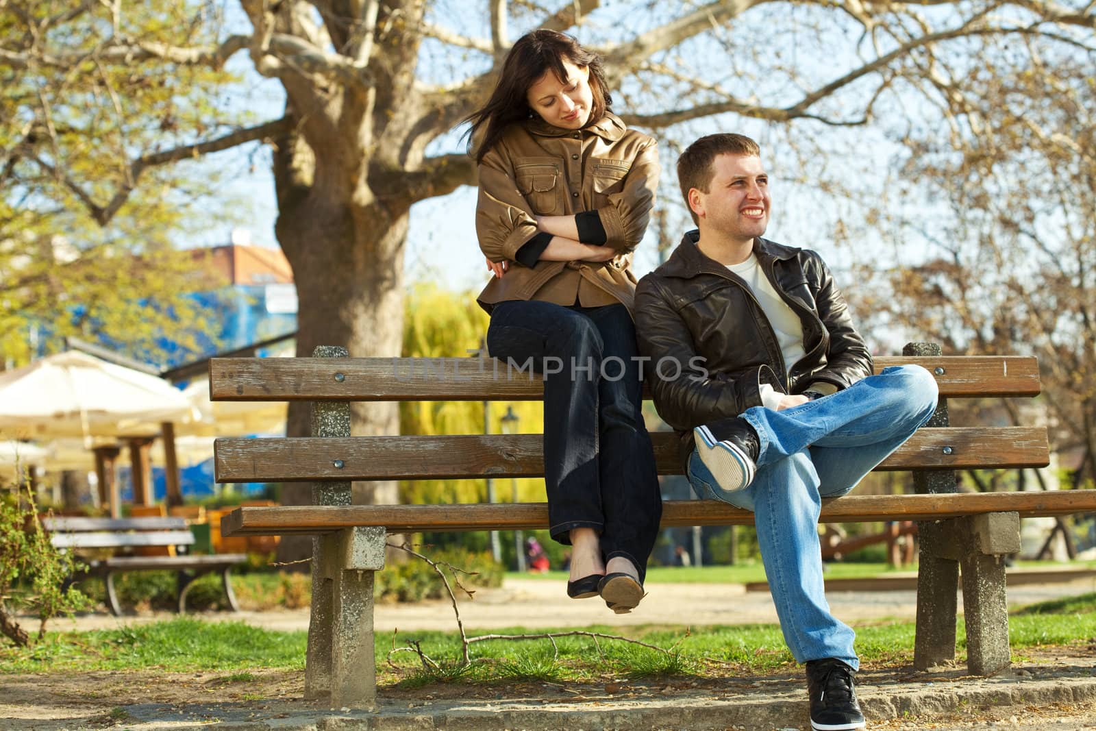 love couple sitting on a bench by jannyjus