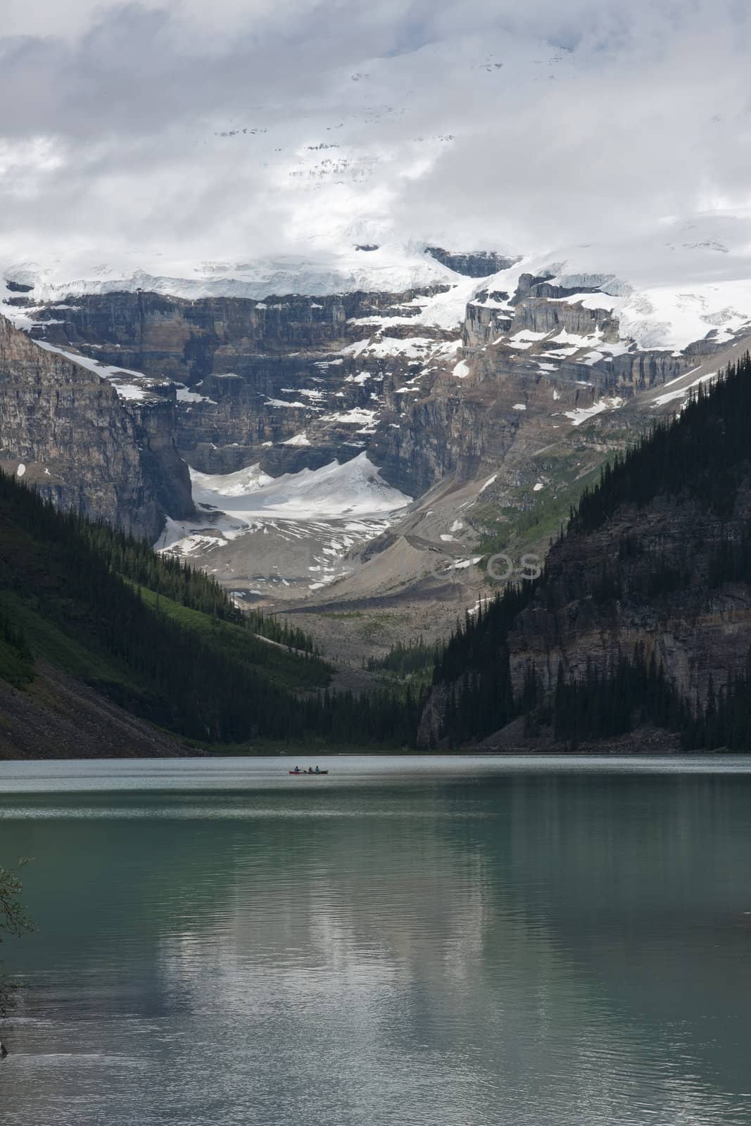 Lake Louise in Alberta (Canada): a canoe glides over the glacier by Claudine