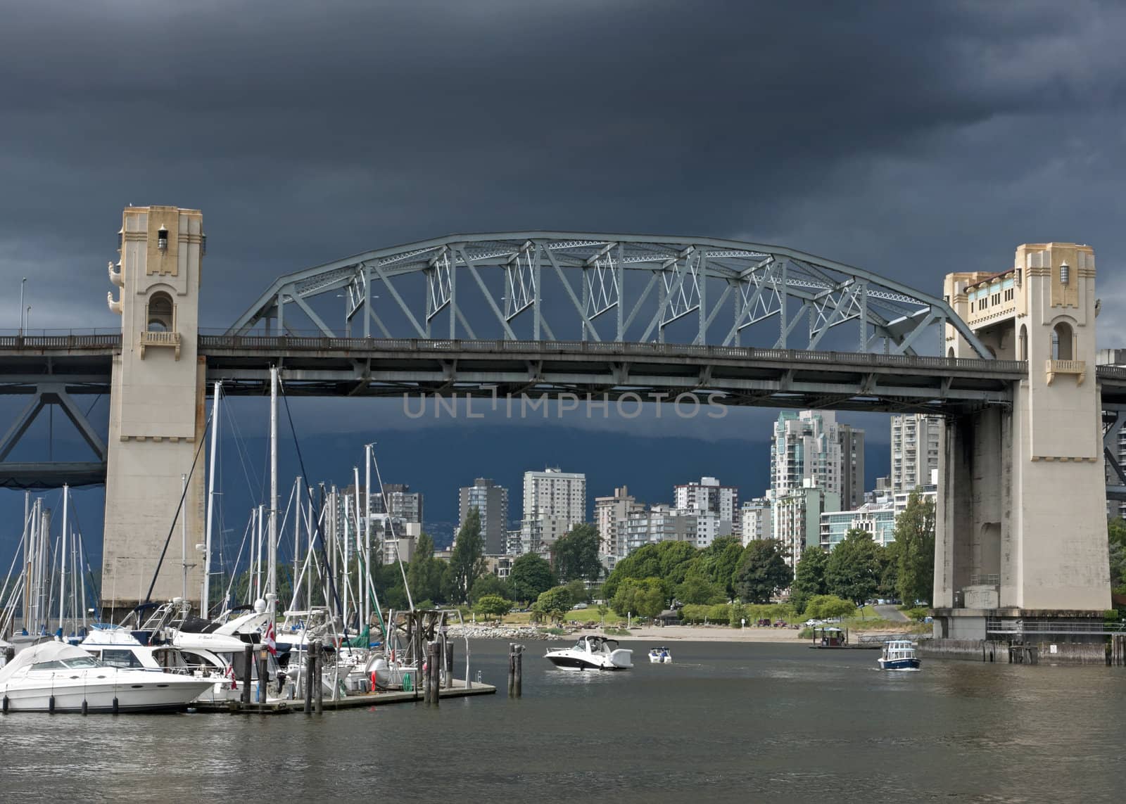 Historic Burrard bridge in Vancouver (Canada) under dark stormy  by Claudine