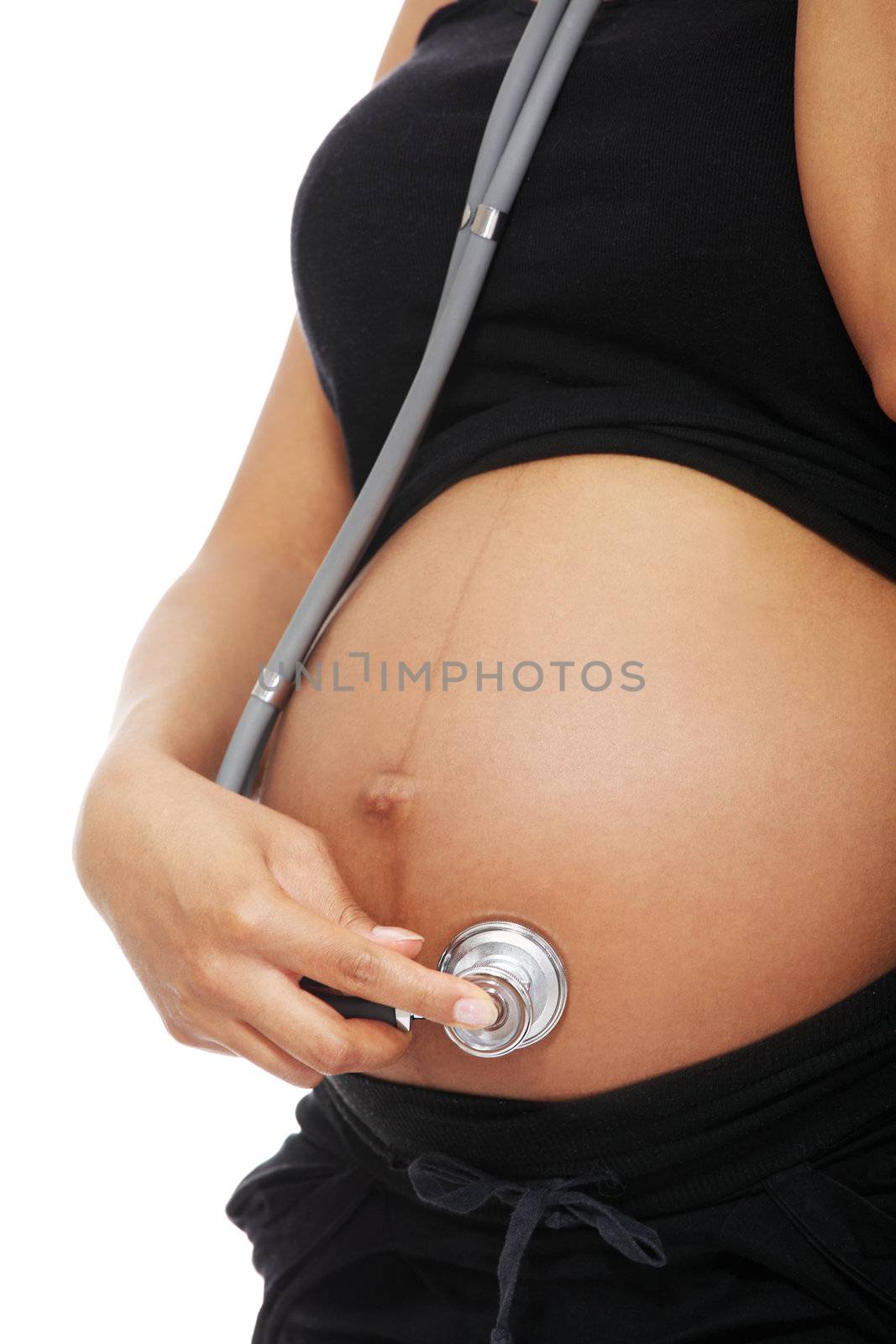 Pregnant woman with a stethoscope. by BDS