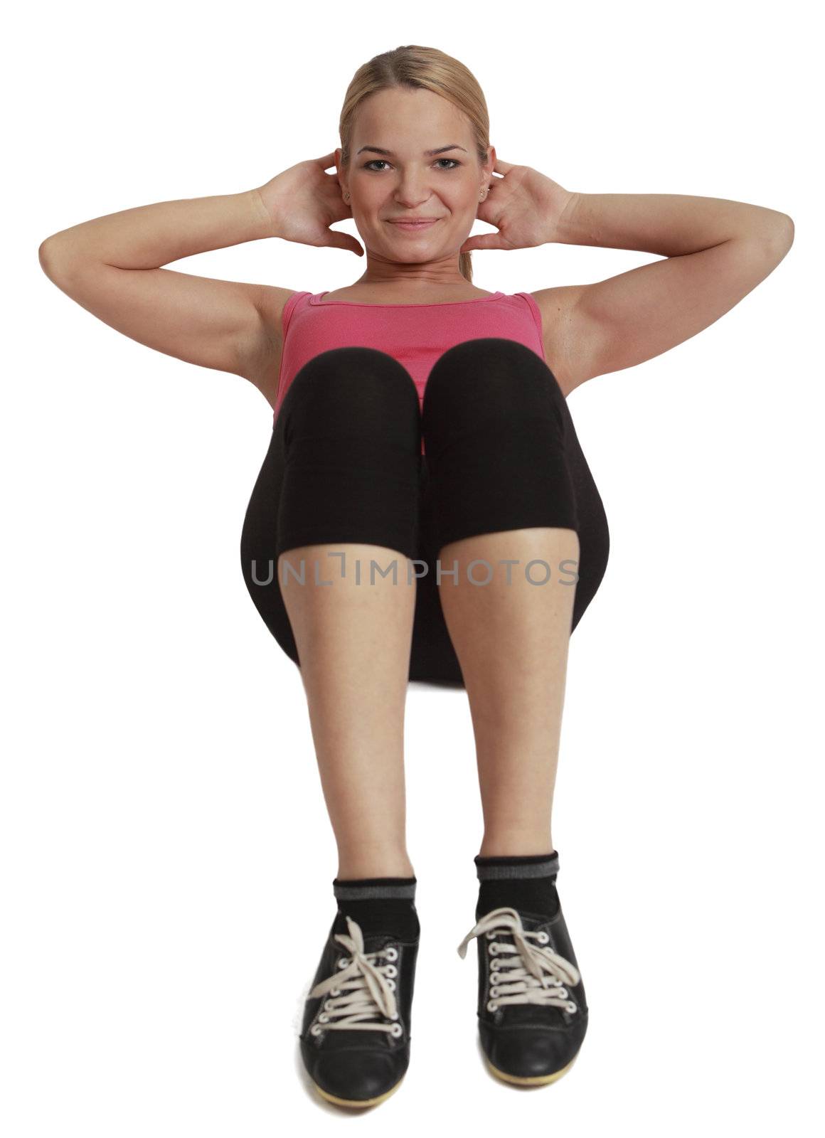 Upper view of a female doing sit-ups isolated against a white background.