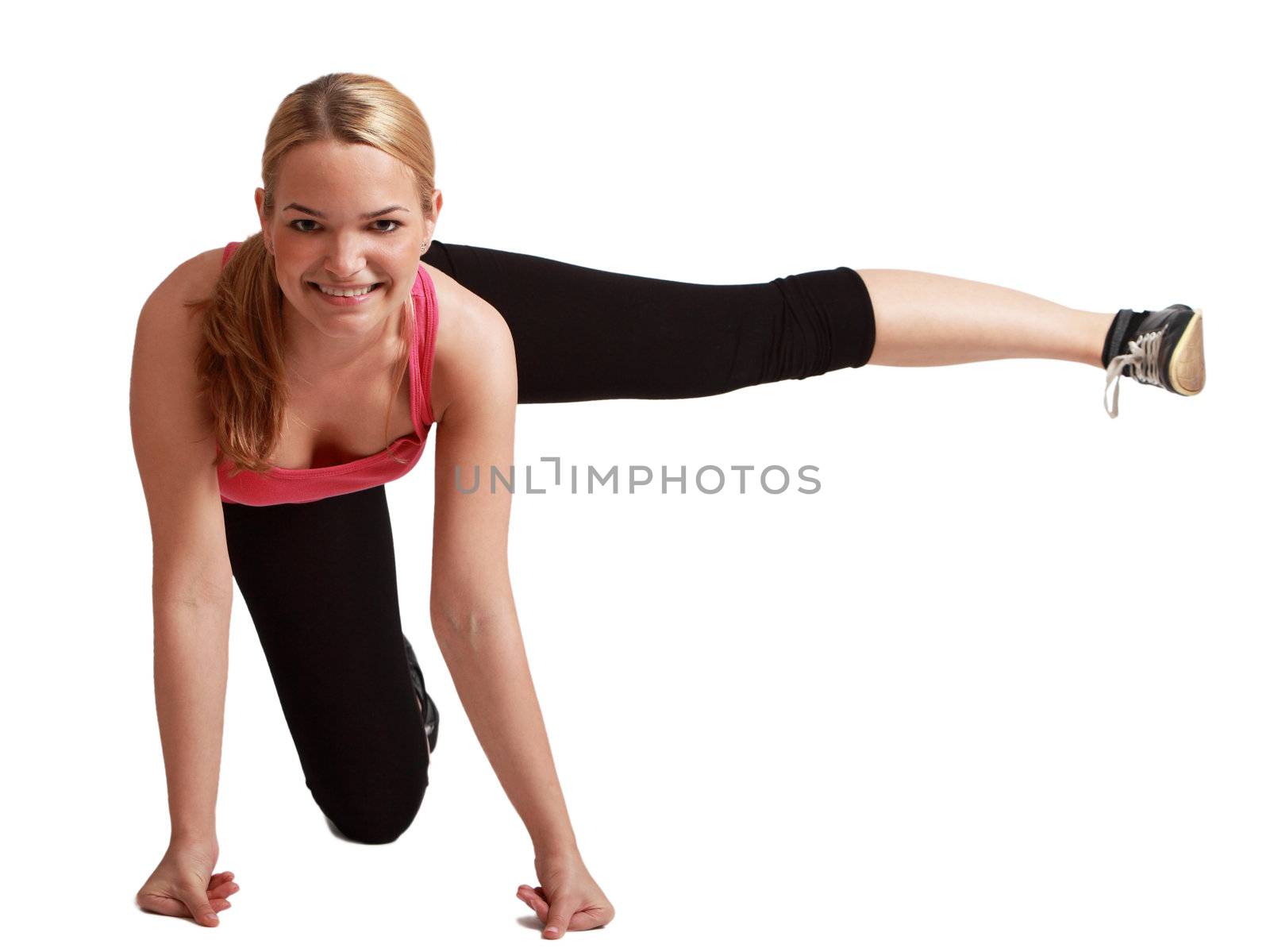 Young blonde woman doing aerobics,against a white background