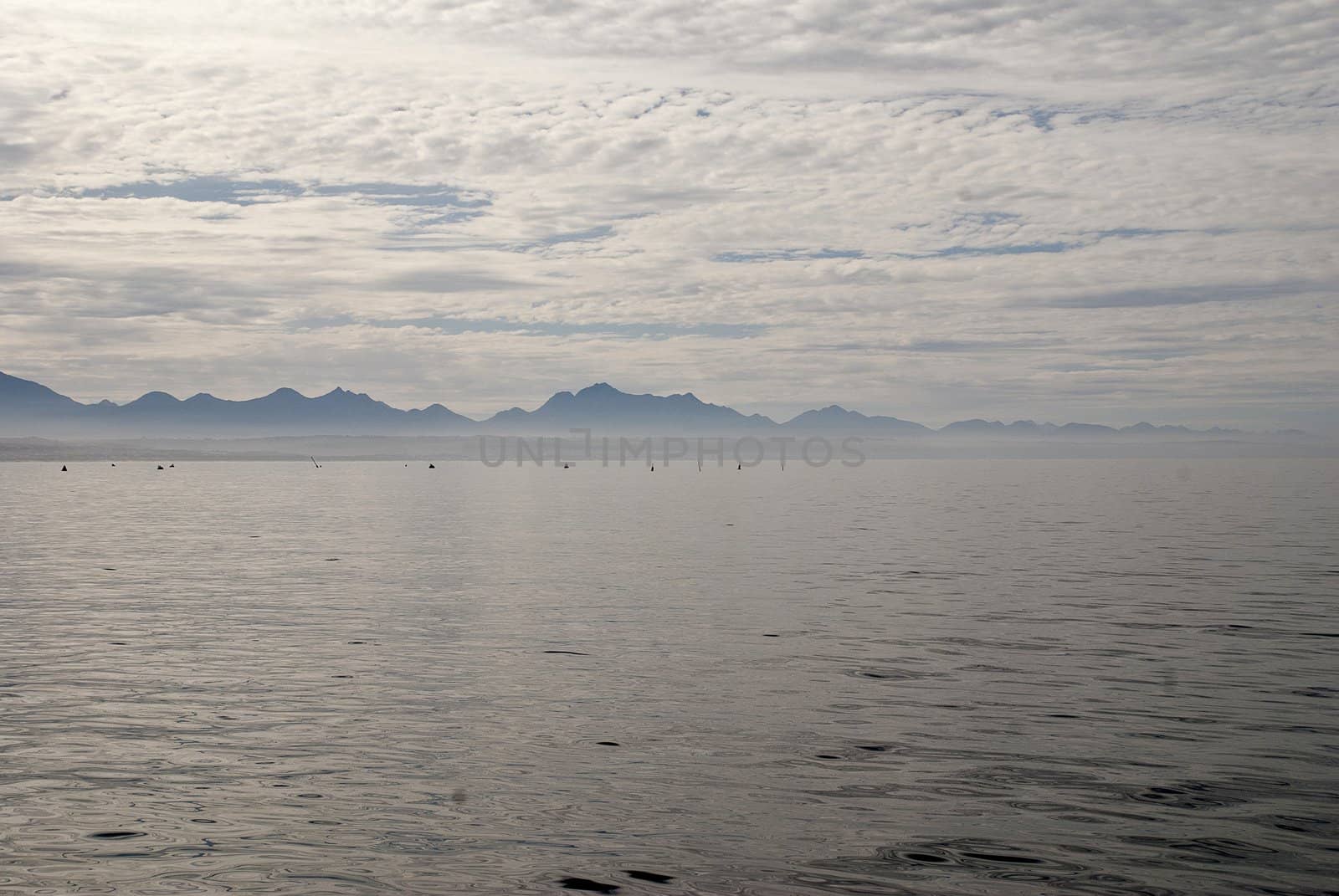 Clouds reflected in the still waters of Mossel Bay