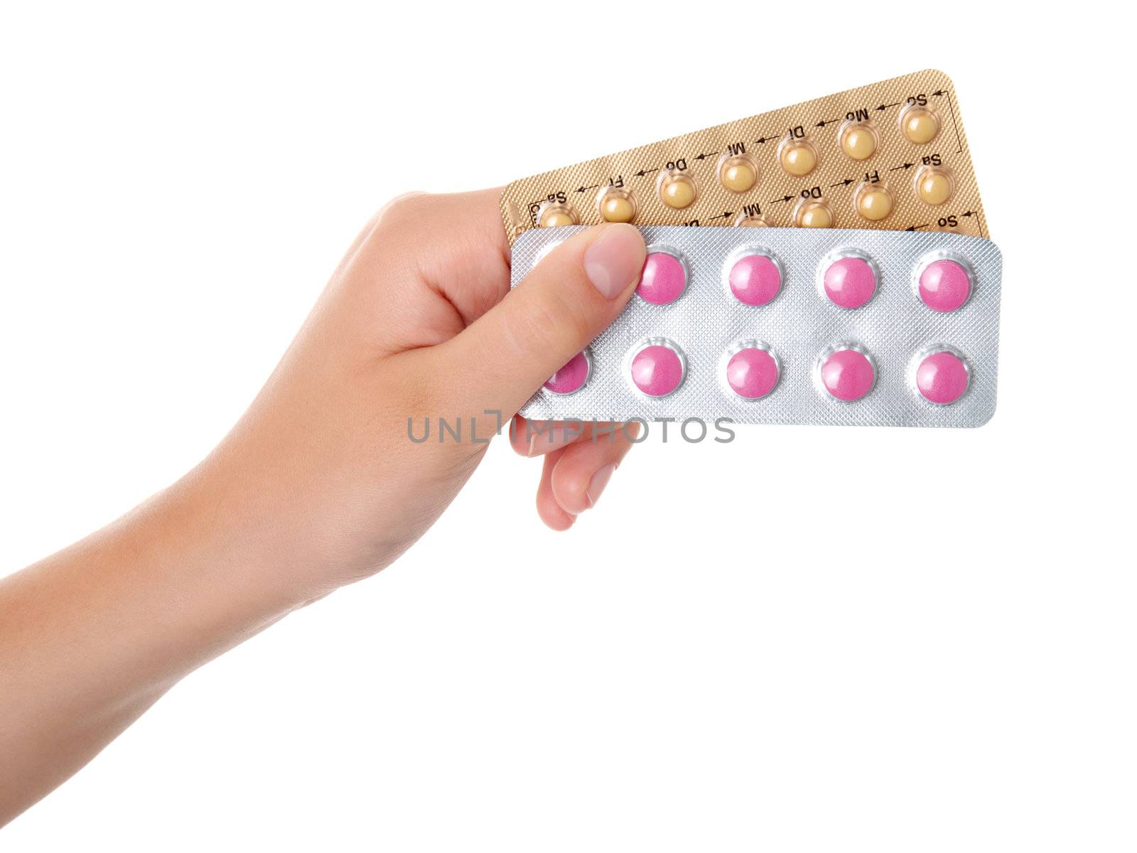 tablets (Birth Control Pills) in the hand, isolated on white background 
