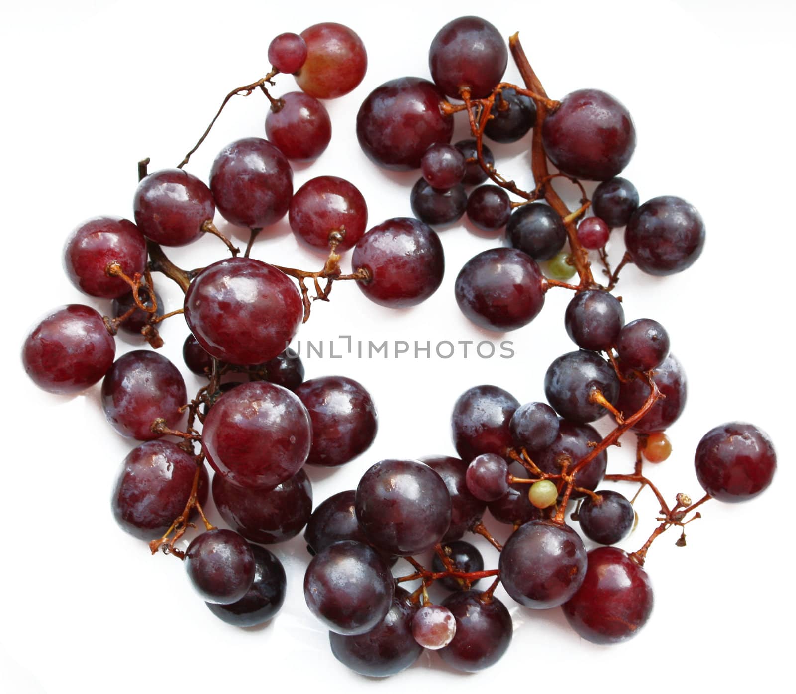 Purple ripe grape isolated on white background


