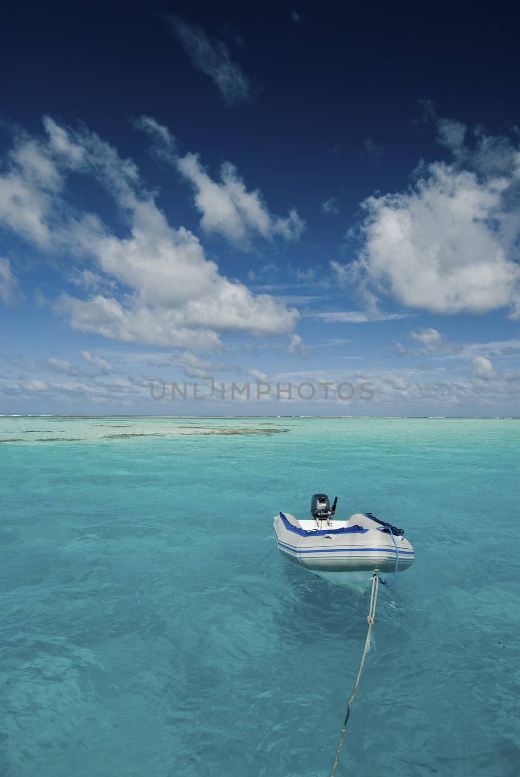 A paradisical seascape with a floating boat, Bassas Da India