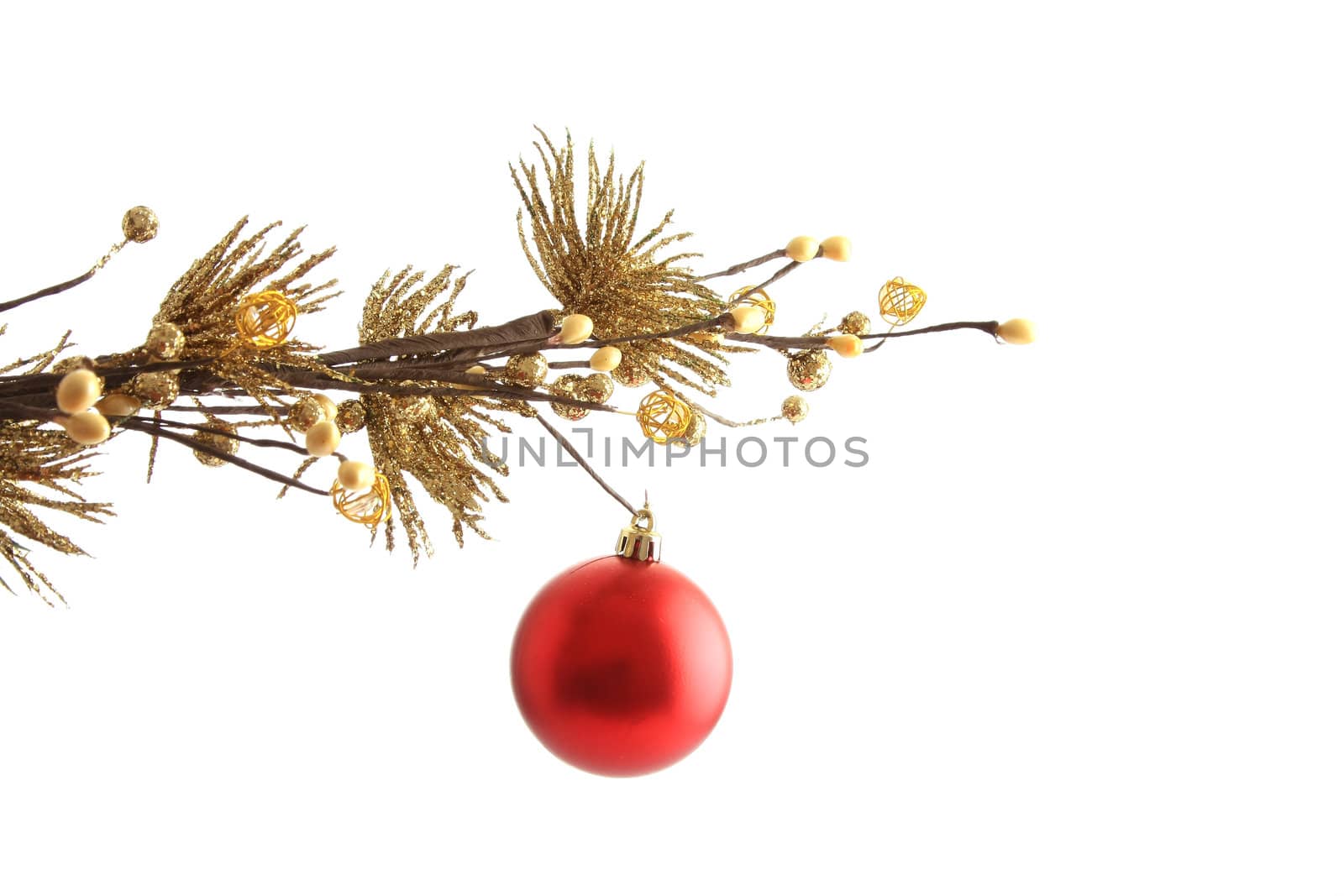 Red christmas ball with curly ribbon