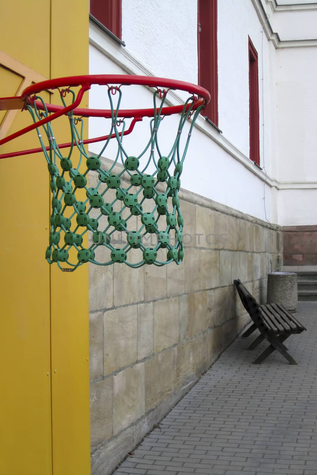 Basketball against a background of an empty school yard by Nickondr