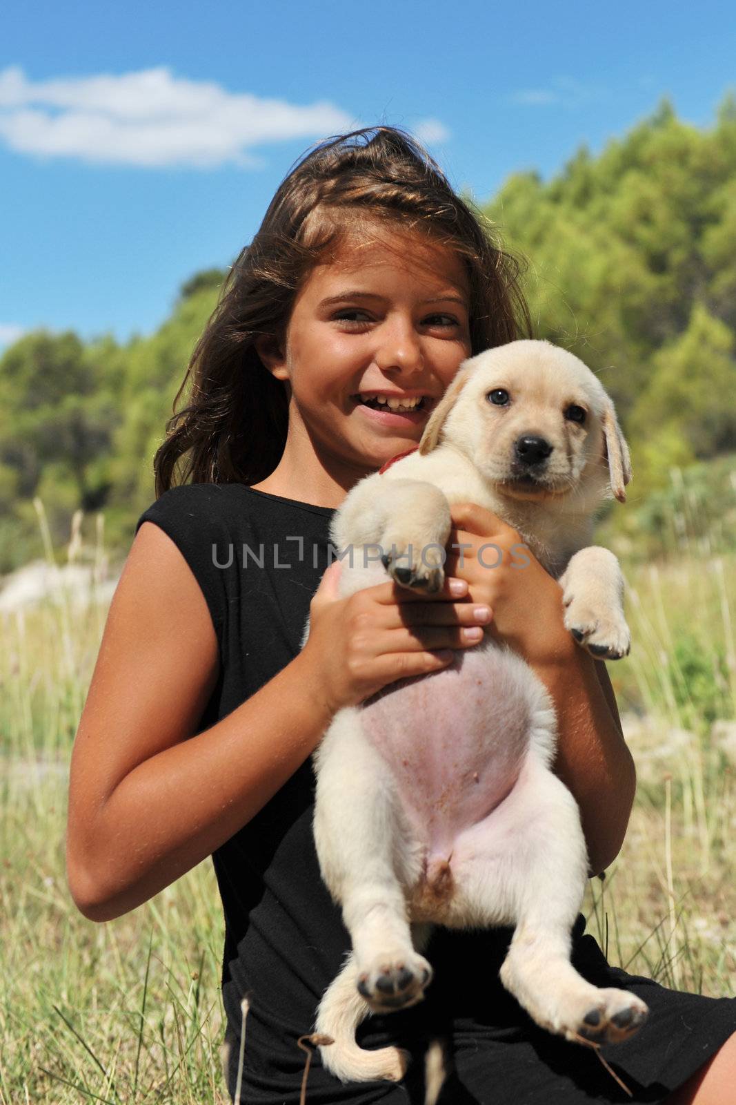  purebred puppy labrador retriever and smiling little girl