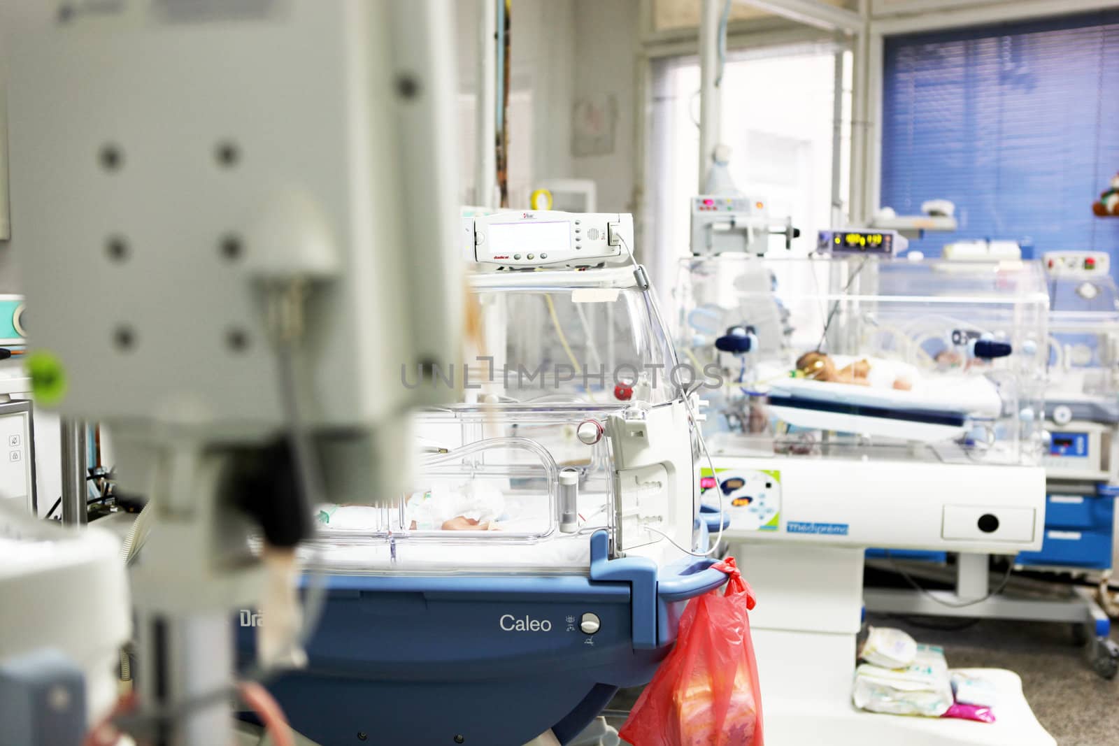 Newborn baby inside incubator