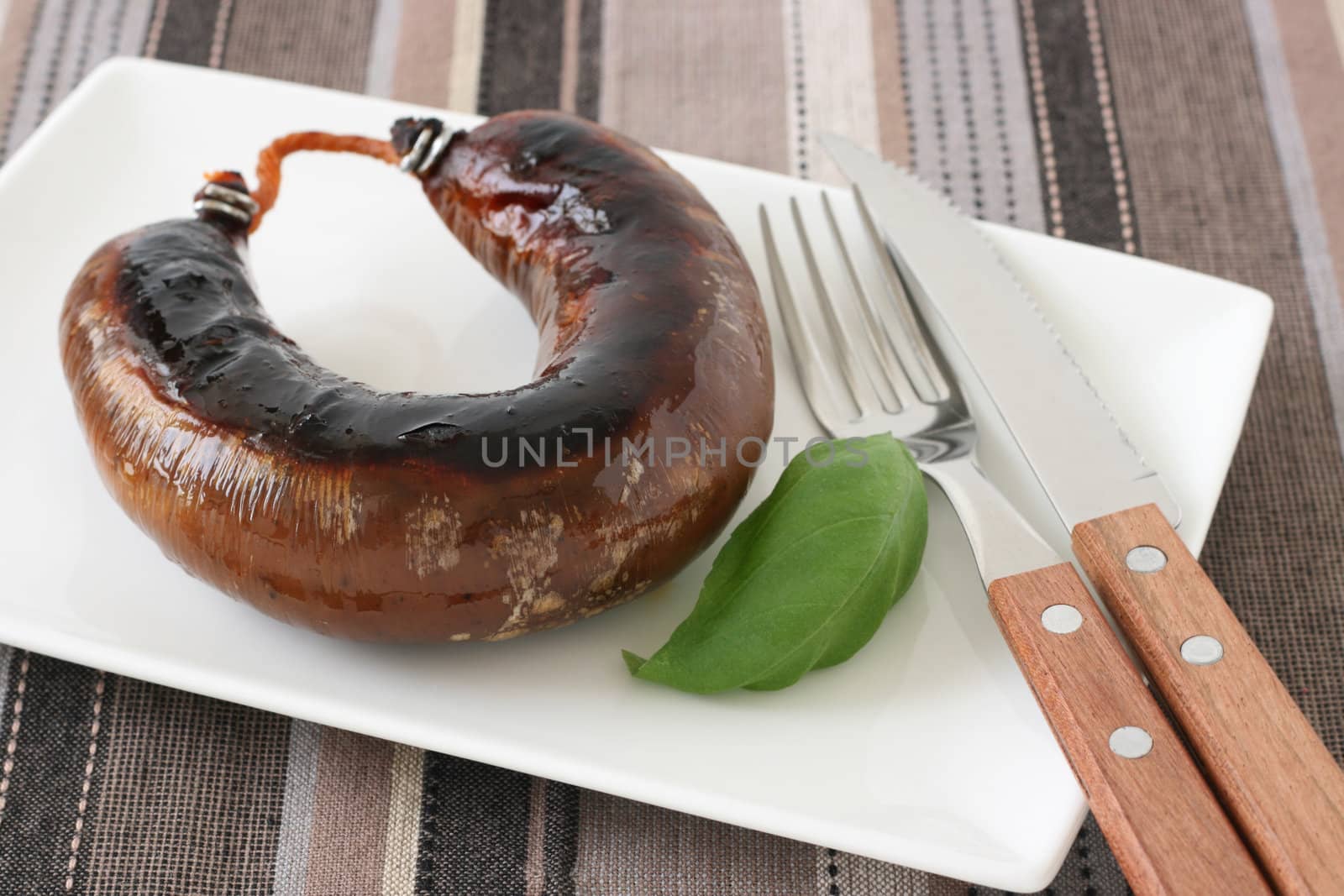 grilled sausage on the plate