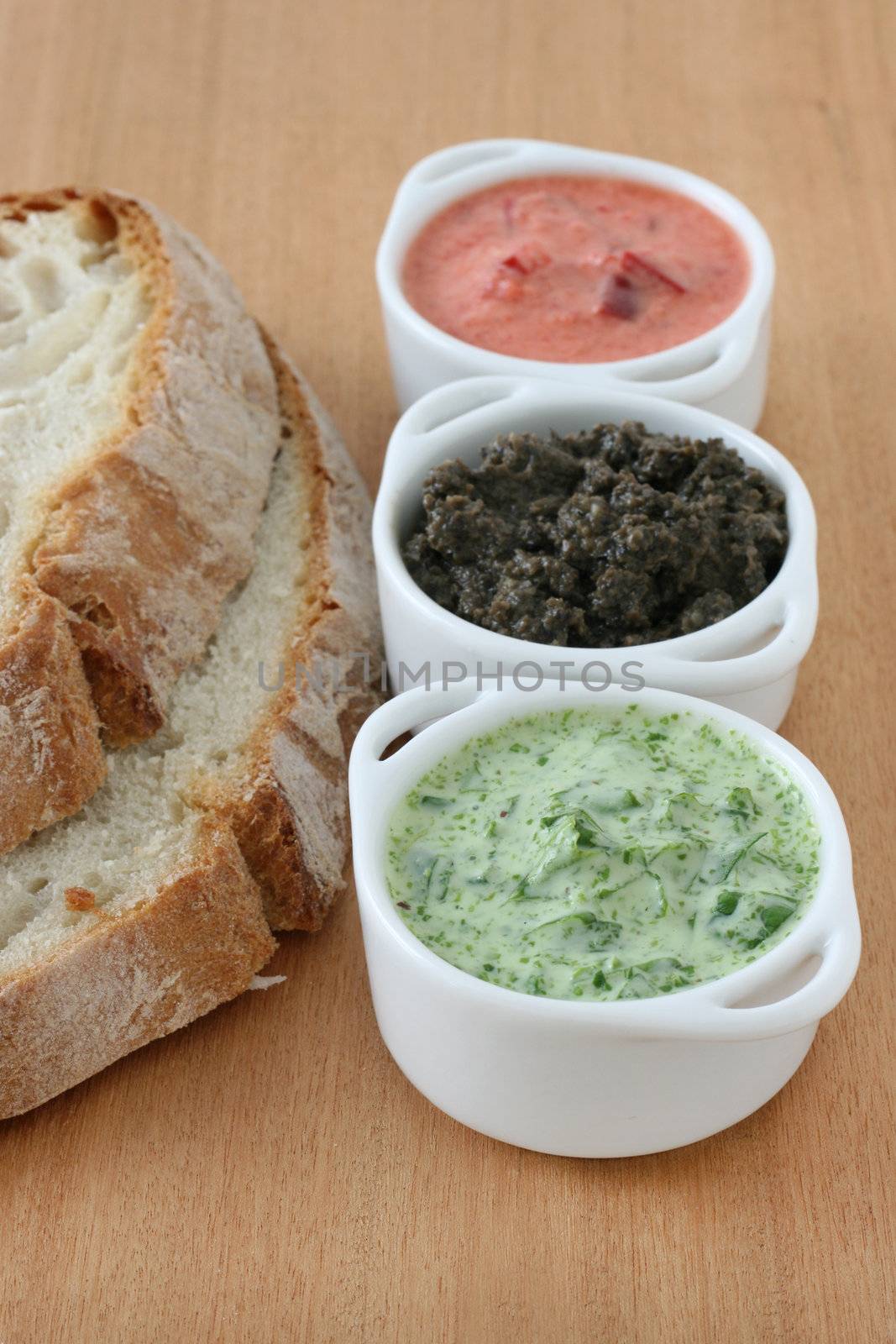 bread with dip in small bowls by nataliamylova