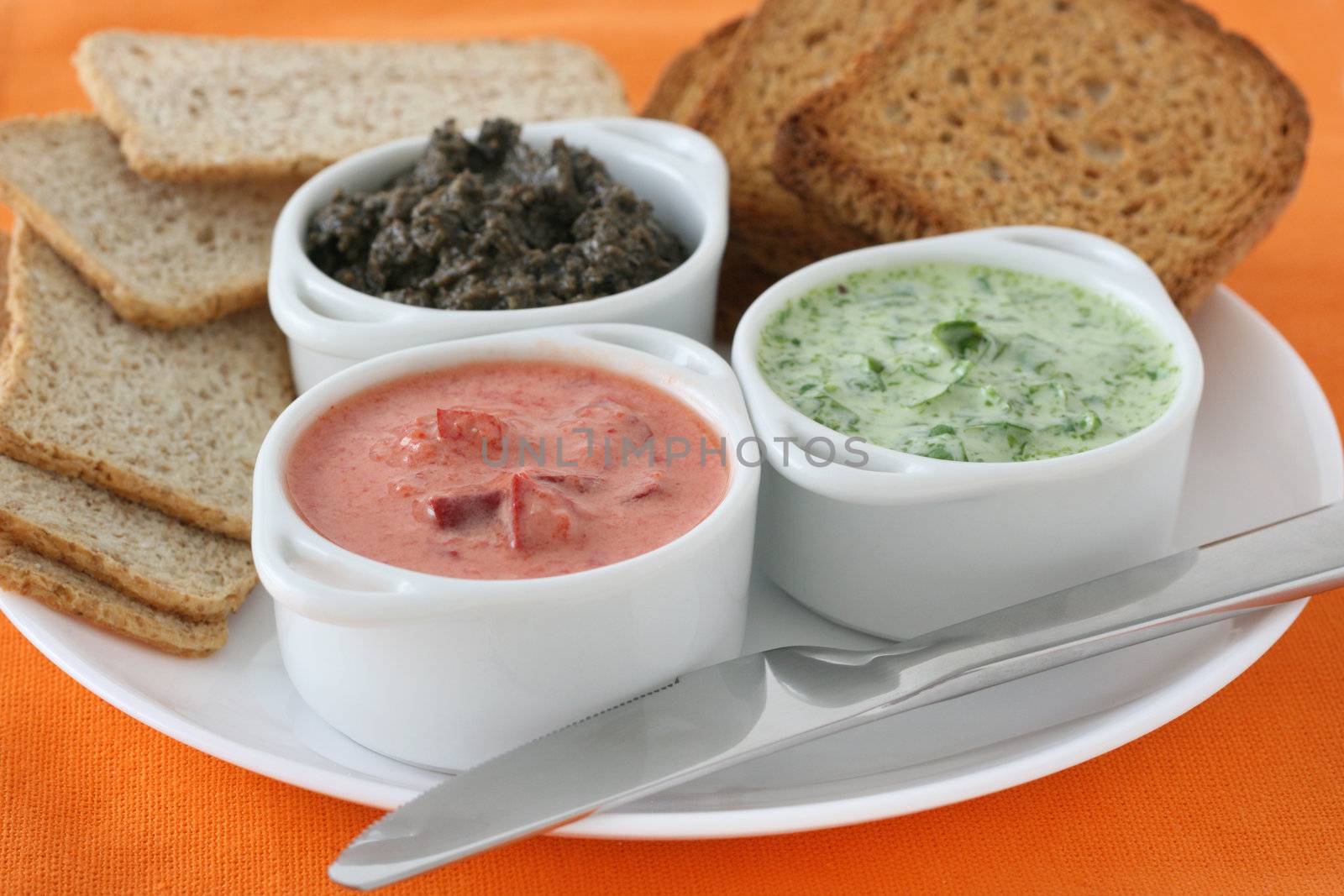 bread with dip in small bowls