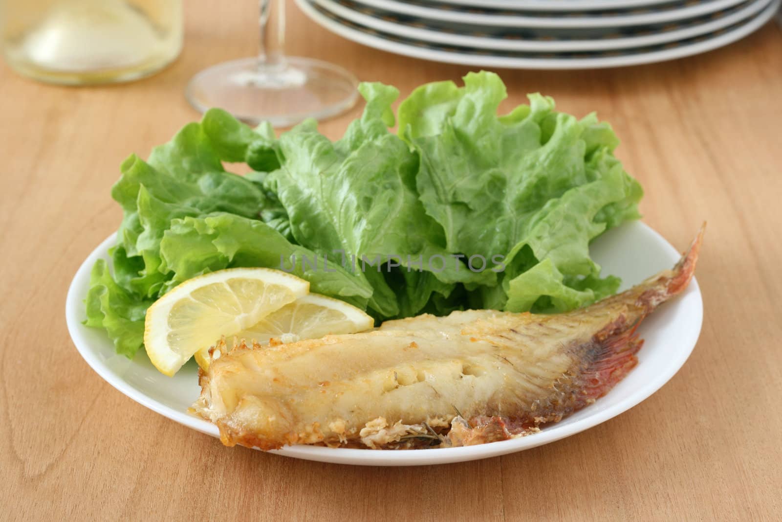 fried fish with salad