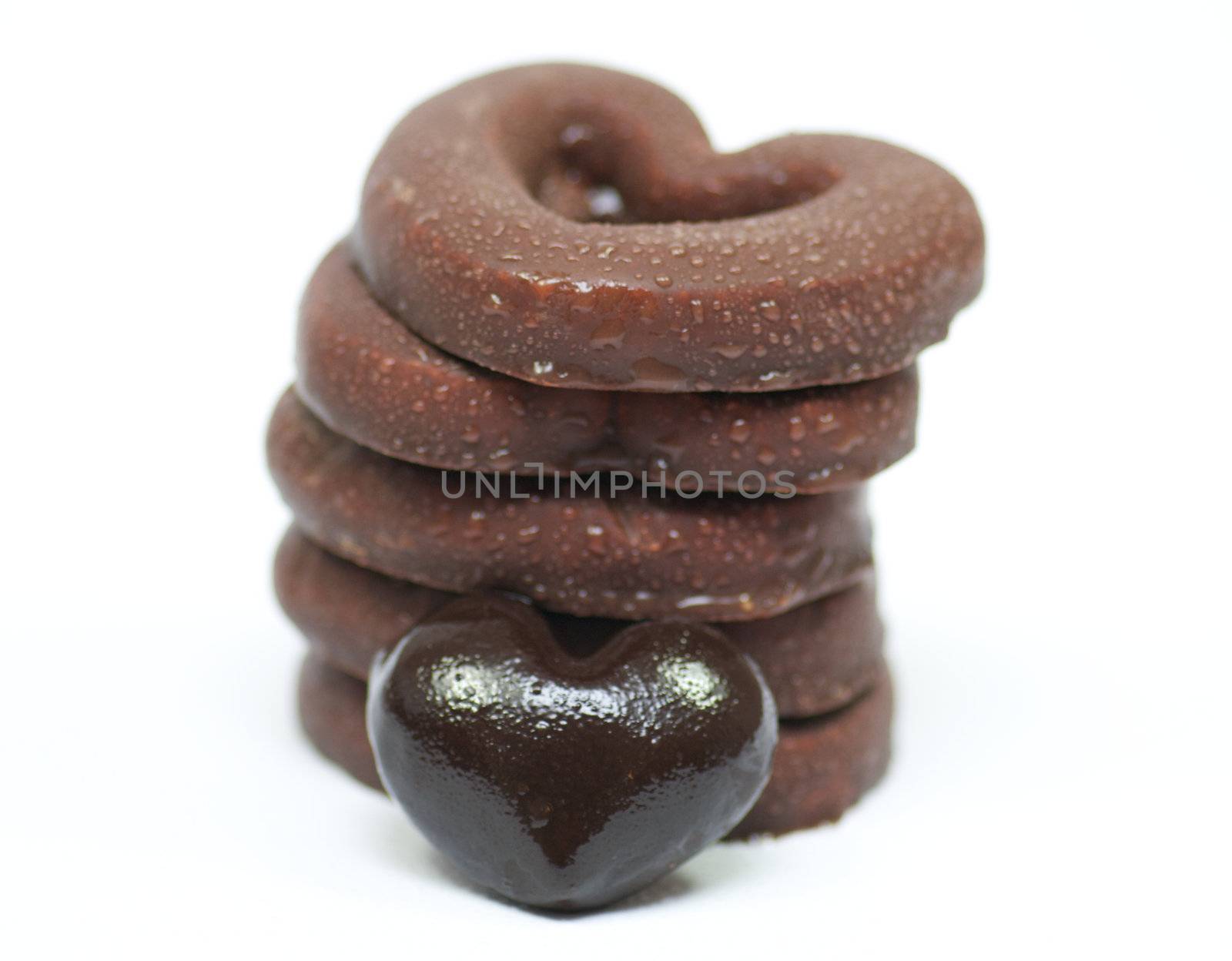 Chocolate hearts-rings in glaze isolated in white background