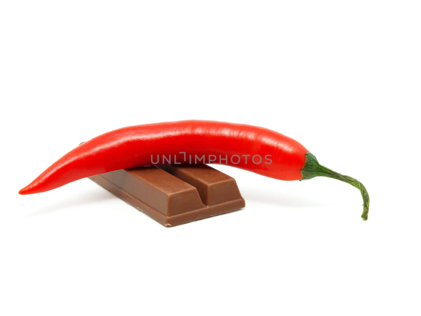 red pepper on  Chocolate,  white background  by motorolka