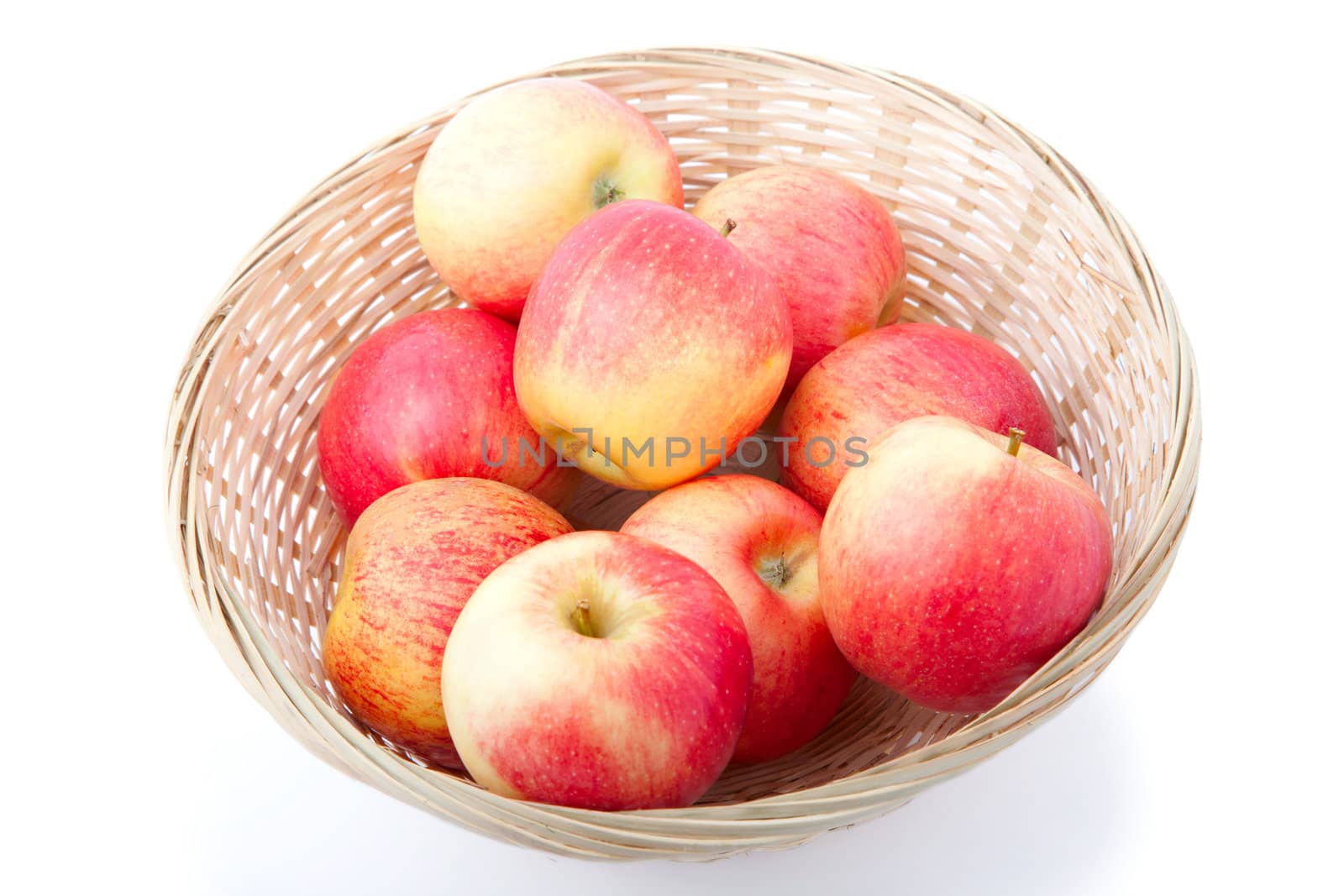 Basket of apples isolated on a white background 