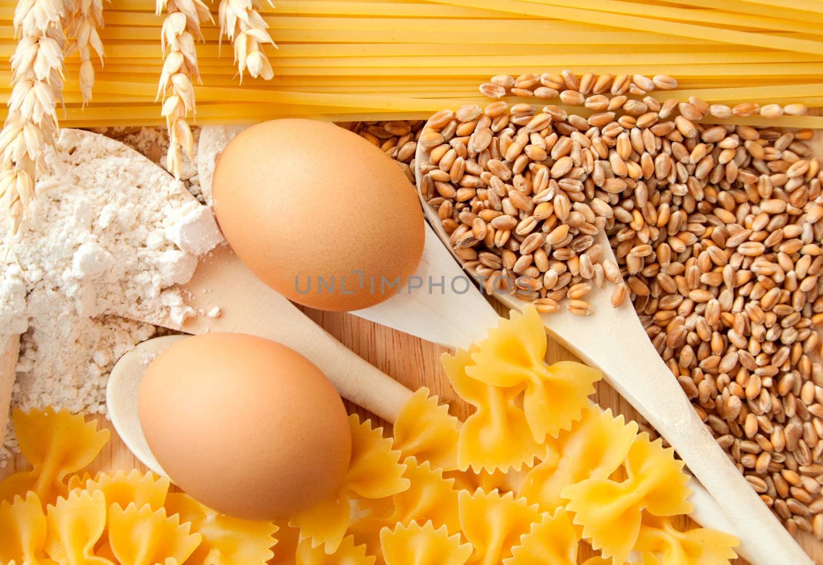 ingredients for homemade pasta. Food background: macaroni, spagetti, egg, flour, wheat 