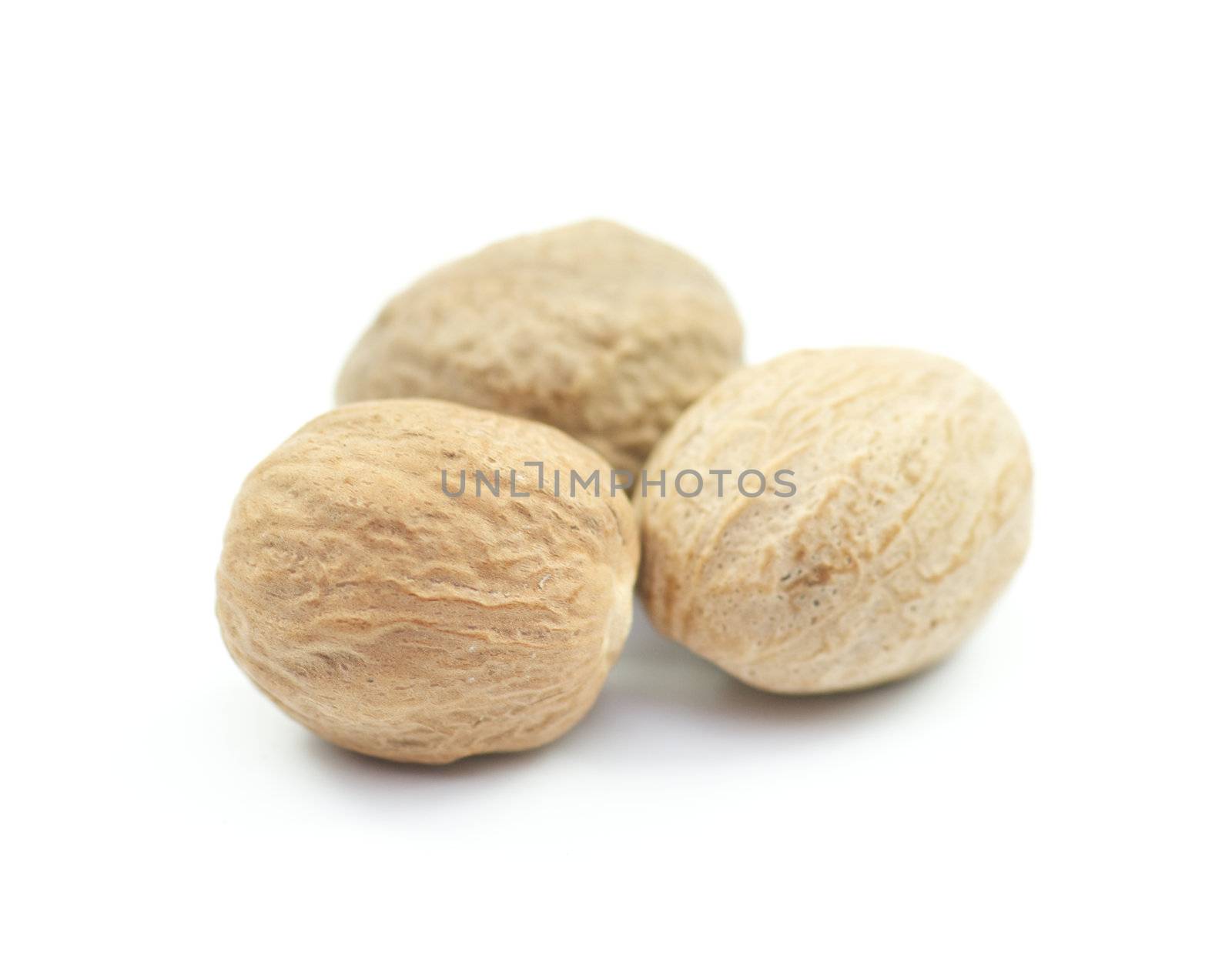 Three Exotic nuts on white background