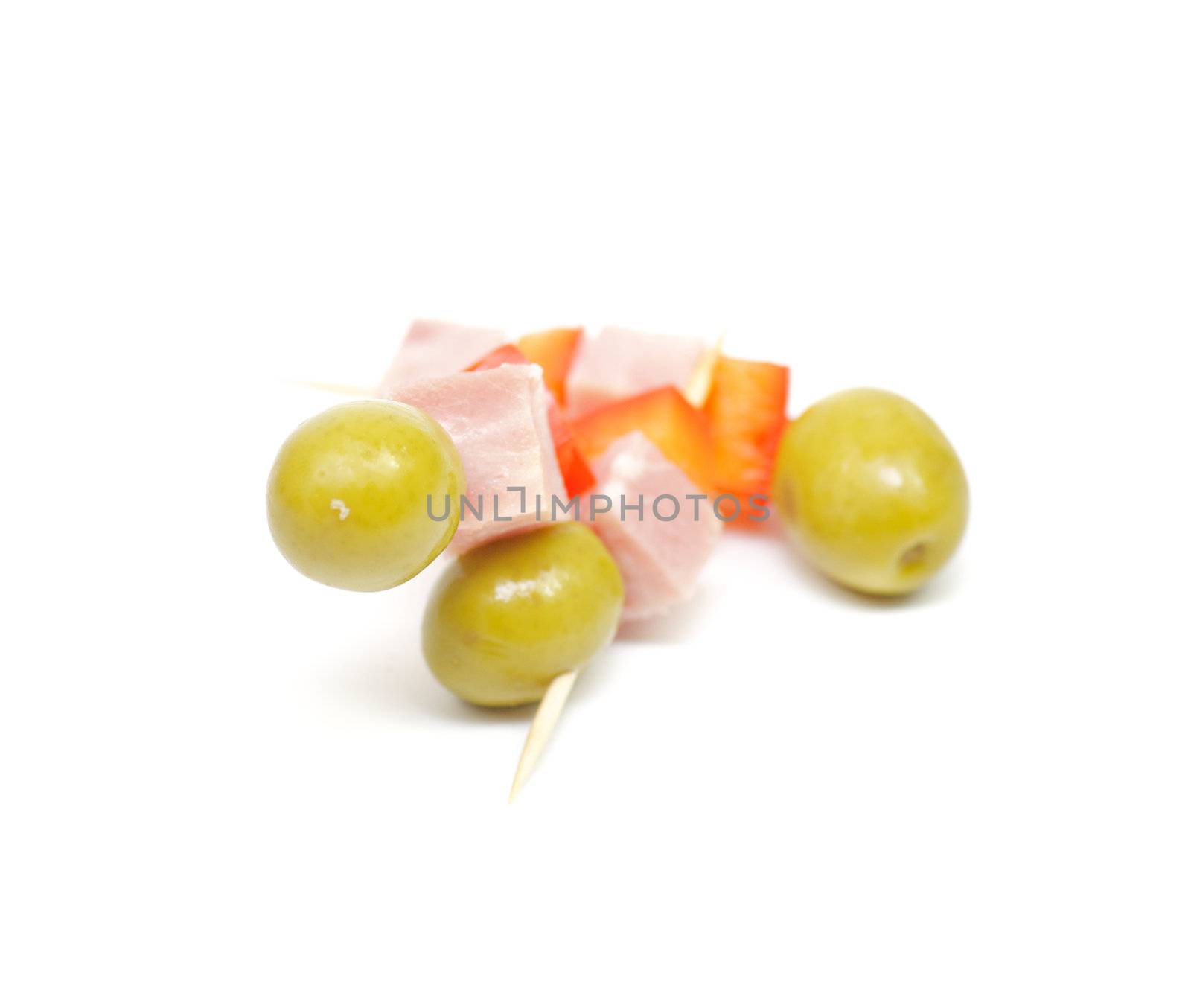 Cocktail snacks with bacon and olives isolated on white background