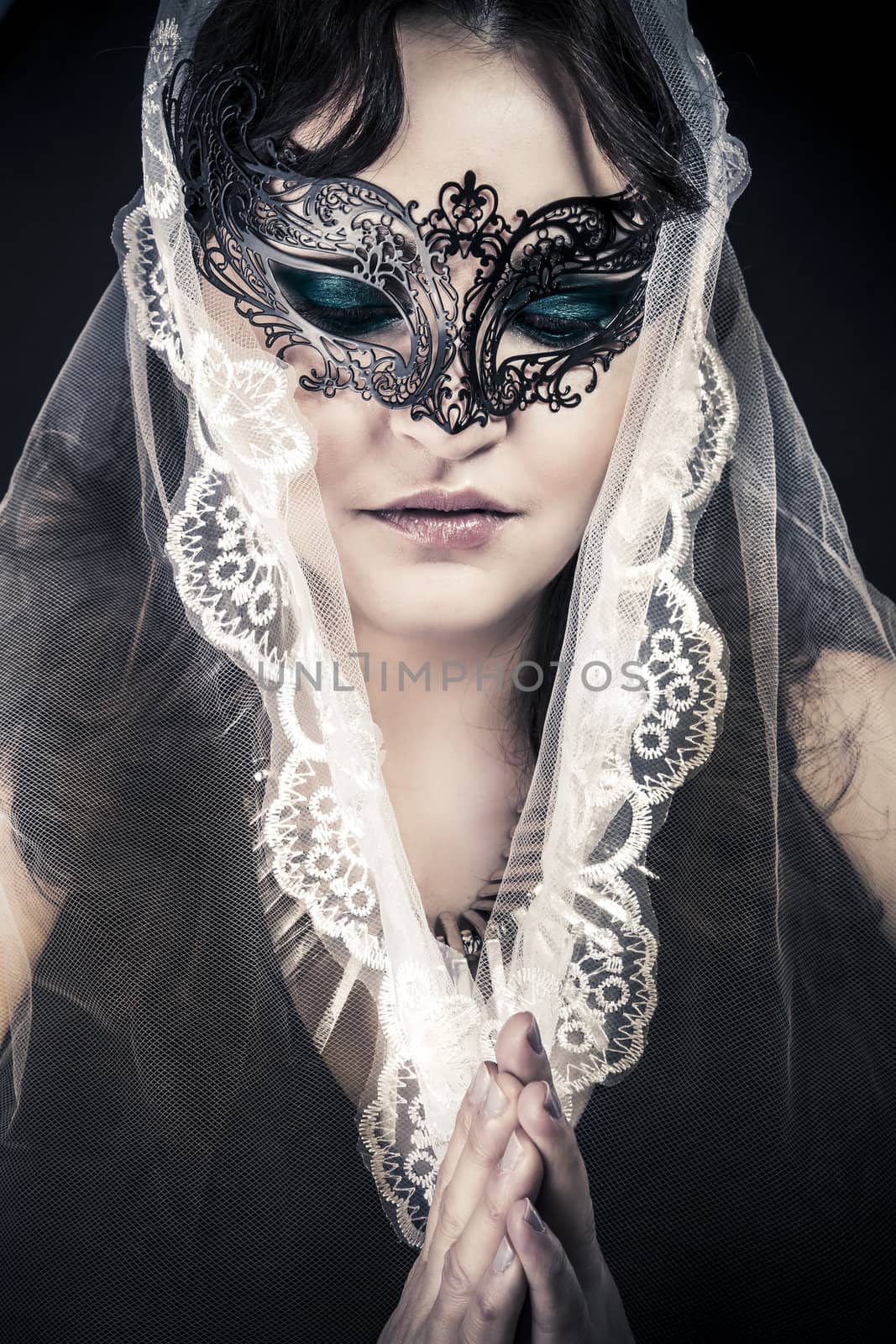 Woman in veil and black dress, glamour scene