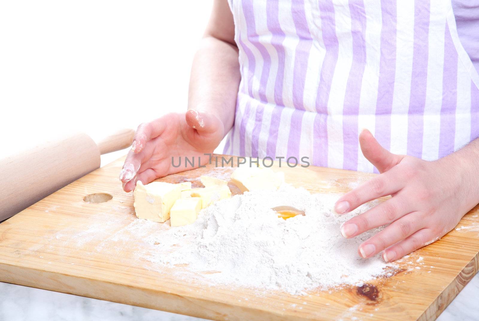 female hands in flour closeup kneading dough by motorolka