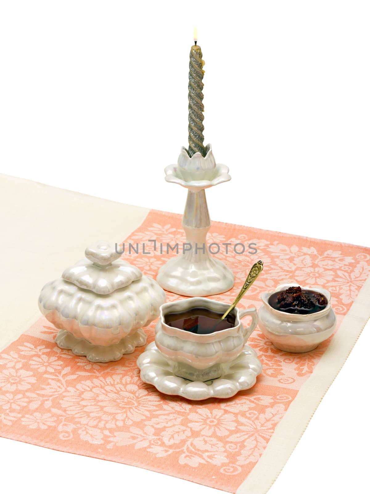 cup of tea and sugar jam on a napkin isolated on white background