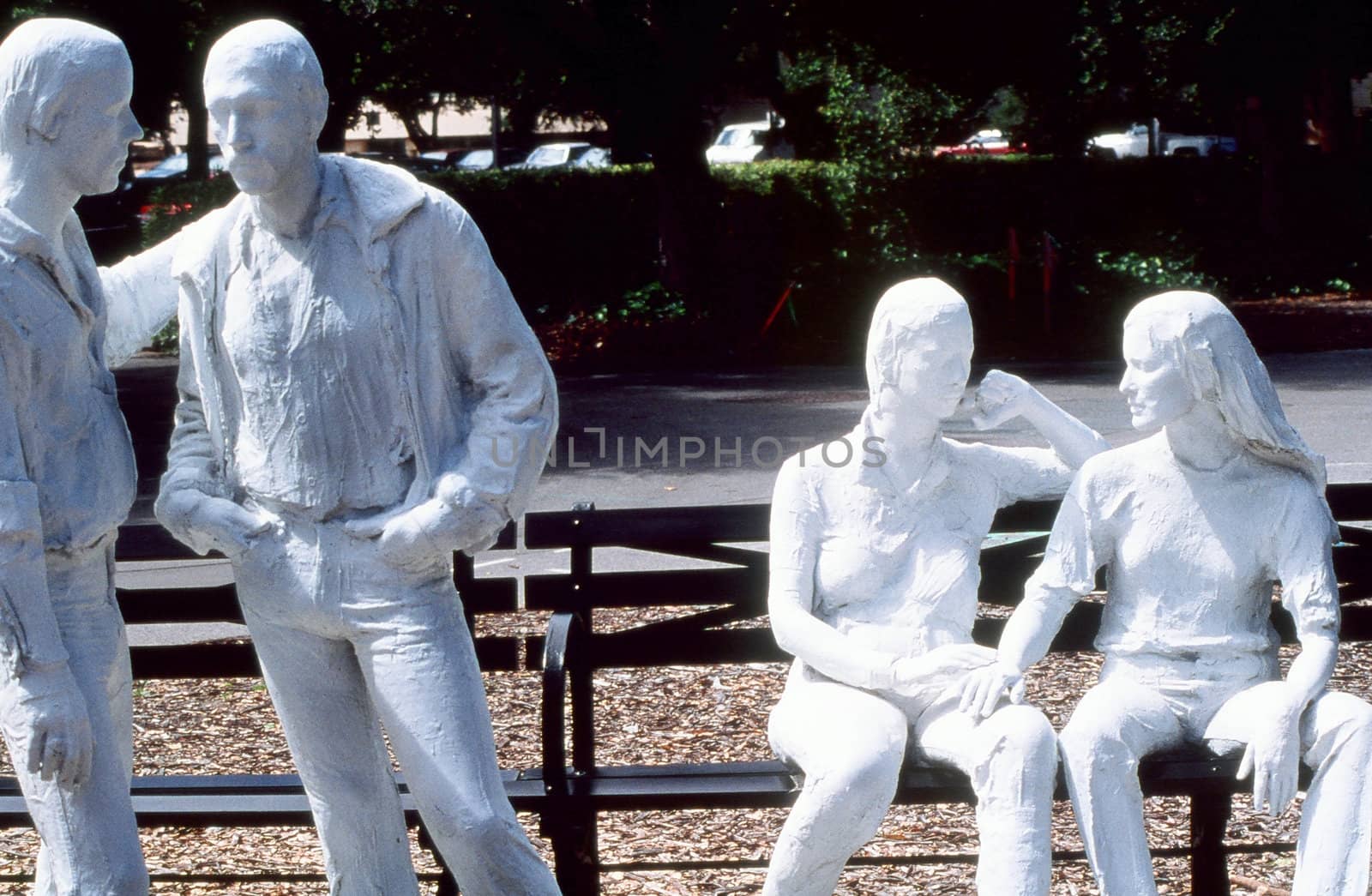 Gay, lesbian statue displayed outdoors.
