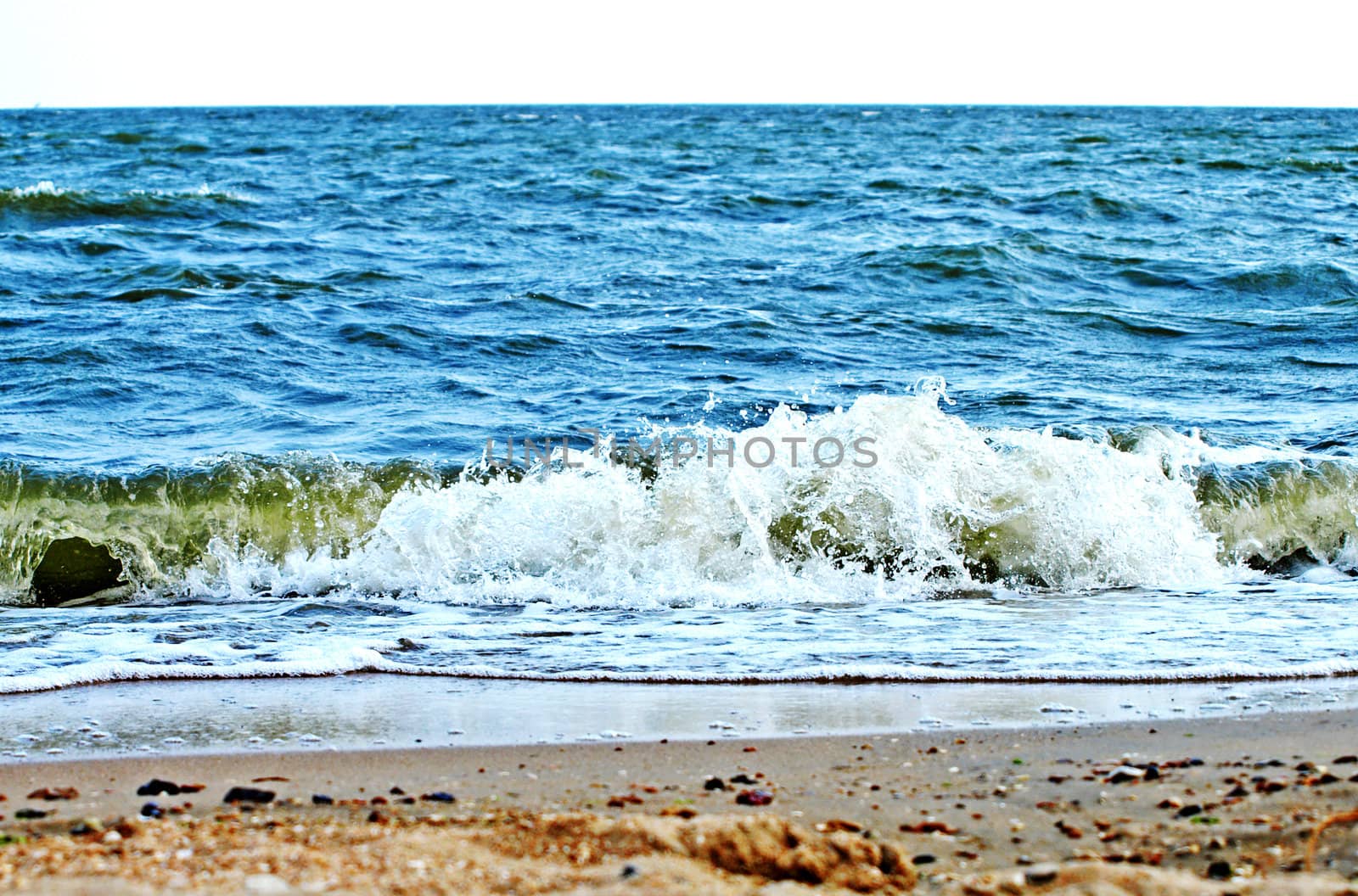 Sand beach and sea surf. 