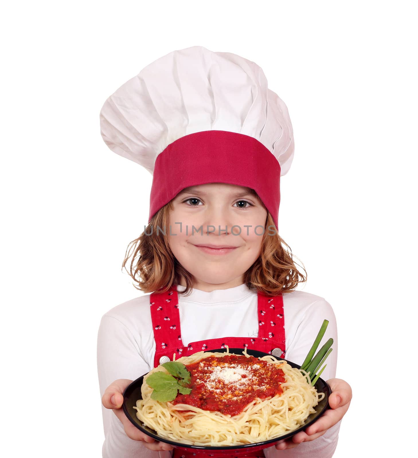 beautiful little girl cook hold dish with spaghetti by goce